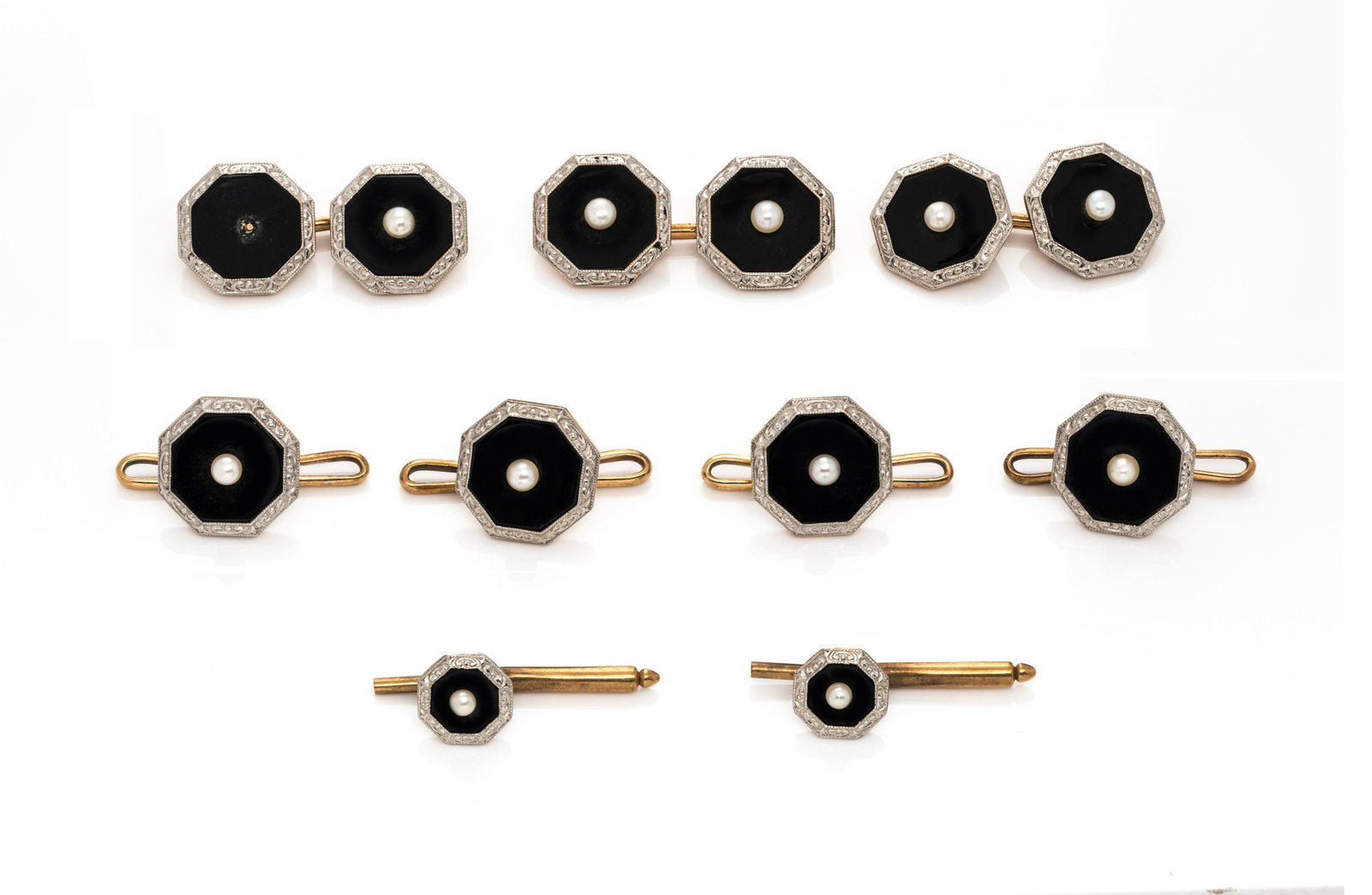 ANTIQUE, ONYX AND PEARL DRESS SET: ANTIQUE, ONYX AND PEARL DRESS SET Consisting of three cufflinks with octagonal onyx plaques surmounted with a pearl and engraved platinum border, together with four matching vest buttons and two small