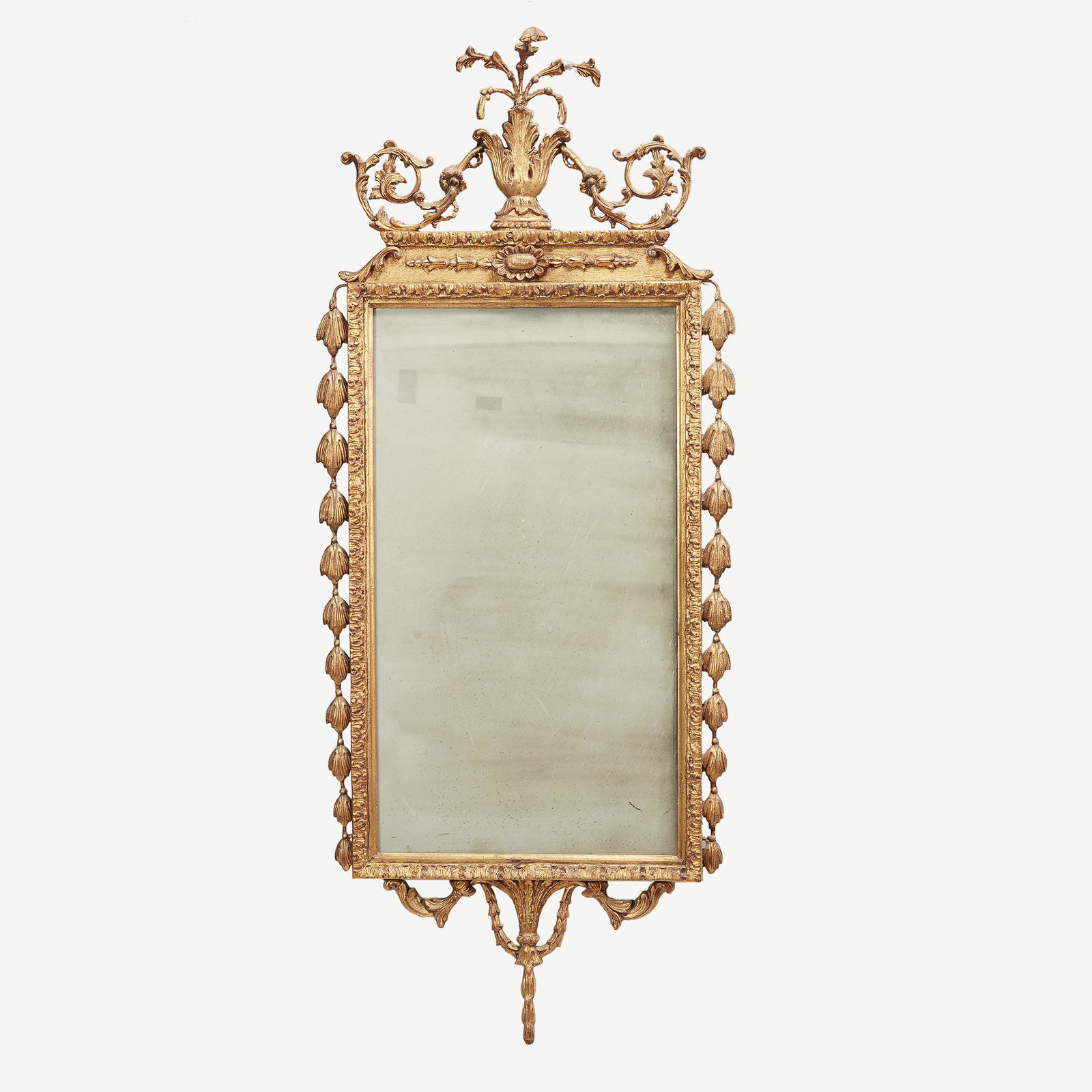 A George III giltwood wall mirror, late 18th century: A George III giltwood wall mirror, late 18th century. With later opaque glass plate. H: 55 in., W: 22 in.