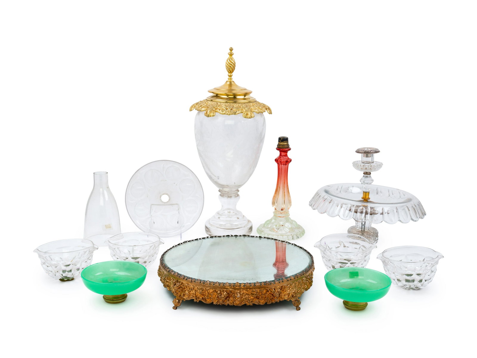 A Gilt Metal Mounted Etched Glass Urn: A Gilt Metal Mounted Etched Glass Urn 20th Century together with a mirrored gilt metal table plateau, 4 wine rinsers and other items; 11 items total. Height of first 21 3/4 inches. Property from Chris
