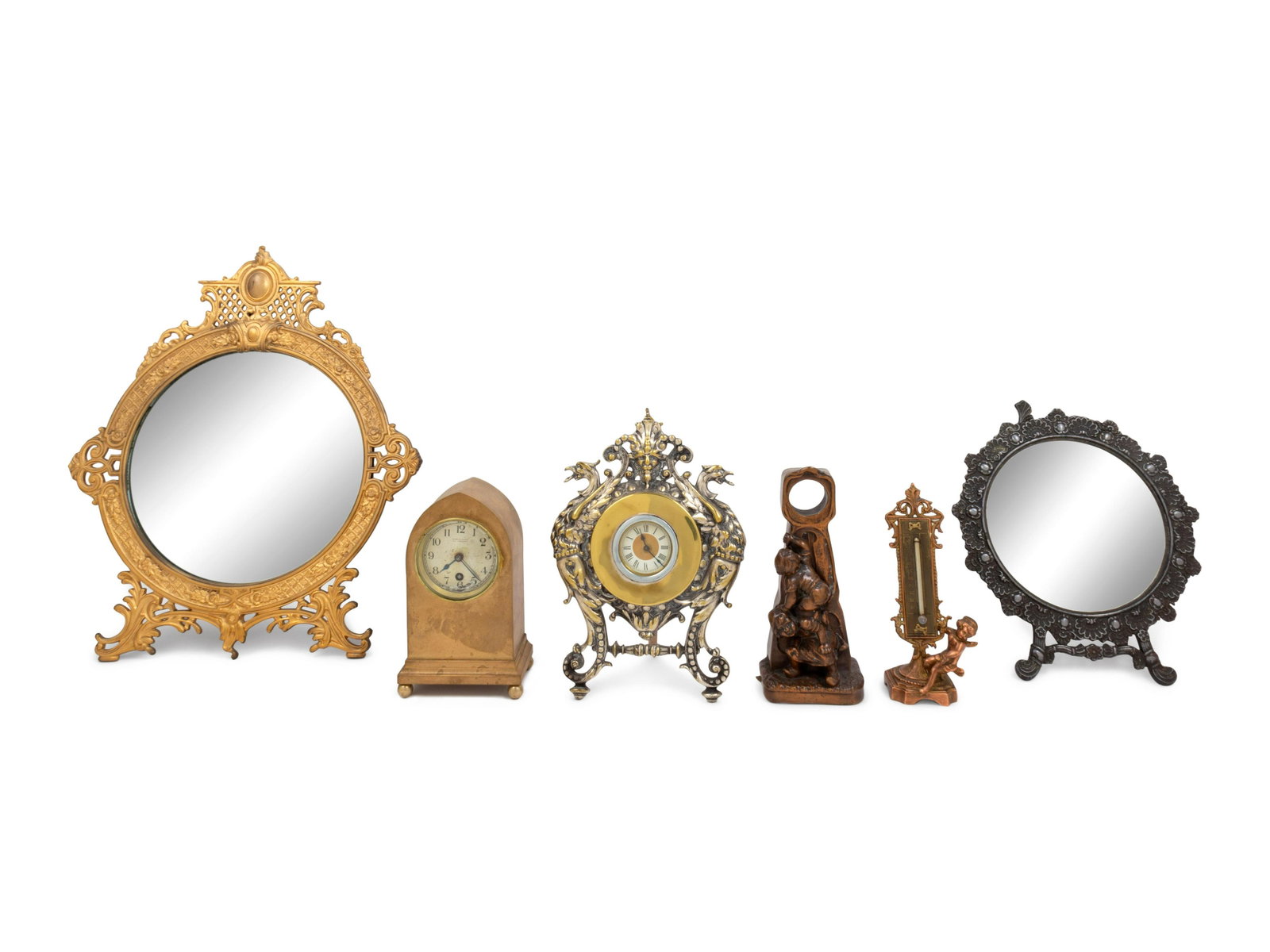 Six Continental Metal Decorative Articles: Six Continental Metal Decorative Articles 19th and 20th Century comprising two clocks, a pocket watch stand, a thermometer and two mirrors; 6 items total. Larger mirror: height 17 x width 14 inches. P