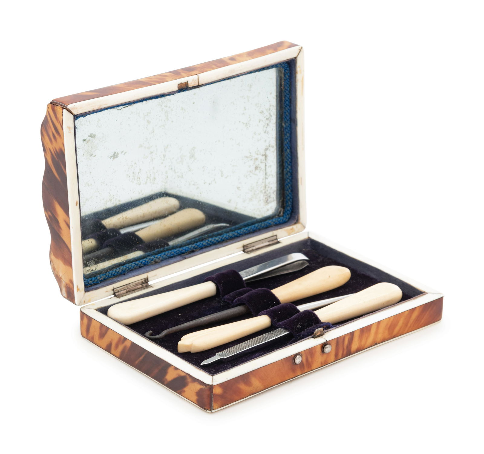 An English Tortoise Shell Mounted Necessaire: An English Tortoise Shell Mounted Necessaire Circa 1820 the interior fitted with a mirror and toiletry tools. Width 5 1/4 inches. Provenance: Lynda Willauer Antiques, Nantucket, Massachusetts Property