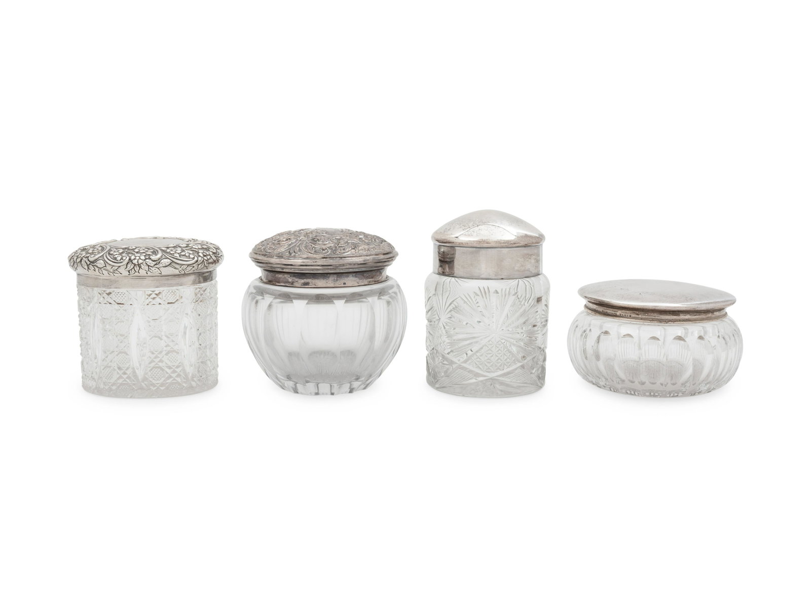 Four Silver Mounted Cut Glass Dresser Jars: Four Silver Mounted Cut Glass Dresser Jars Circa 1900 comprising two English examples and two American examples. Property from the Collection of Mr. James Lee Soffer, Pittsburgh, Pennsylvania