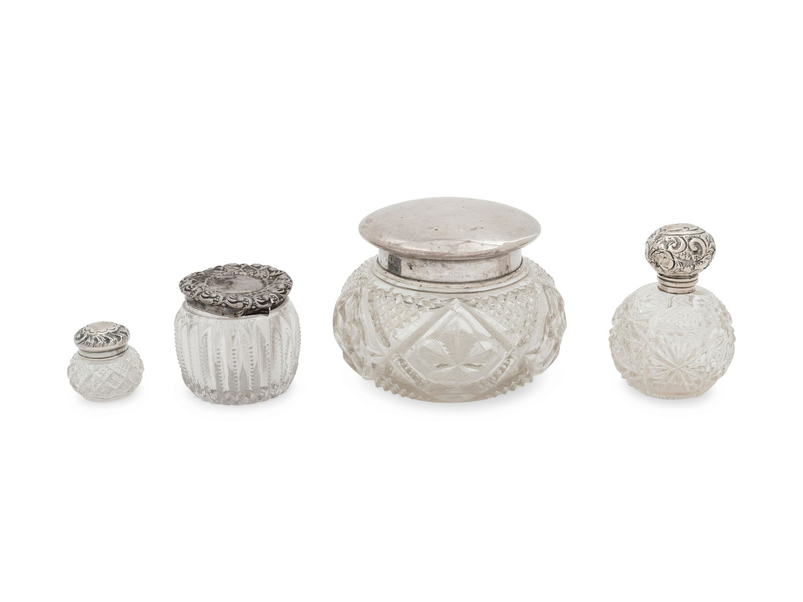 Four Silver Mounted Cut Glass Jars: Four Silver Mounted Cut Glass Jars Circa 1900 Height of tallest 3 1/2 inches. Property from the Collection of Mr. James Lee Soffer, Pittsburgh, Pennsylvania