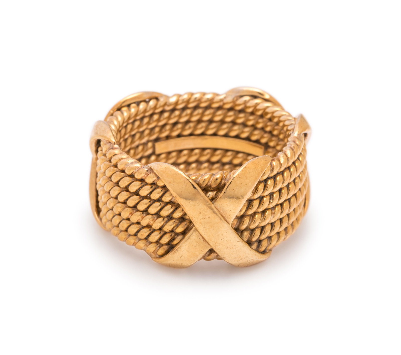 TIFFANY & CO., SCHLUMBERGER, YELLOW GOLD 'X' RING: TIFFANY & CO., SCHLUMBERGER, YELLOW GOLD 'X' RING Consisting of a textured gold ring measuring approximately 11.00 mm wide, with 'X' detail. Stamp: TIFFANY SCHLUMBERGER 18K. 9.25 dwt. Property from an