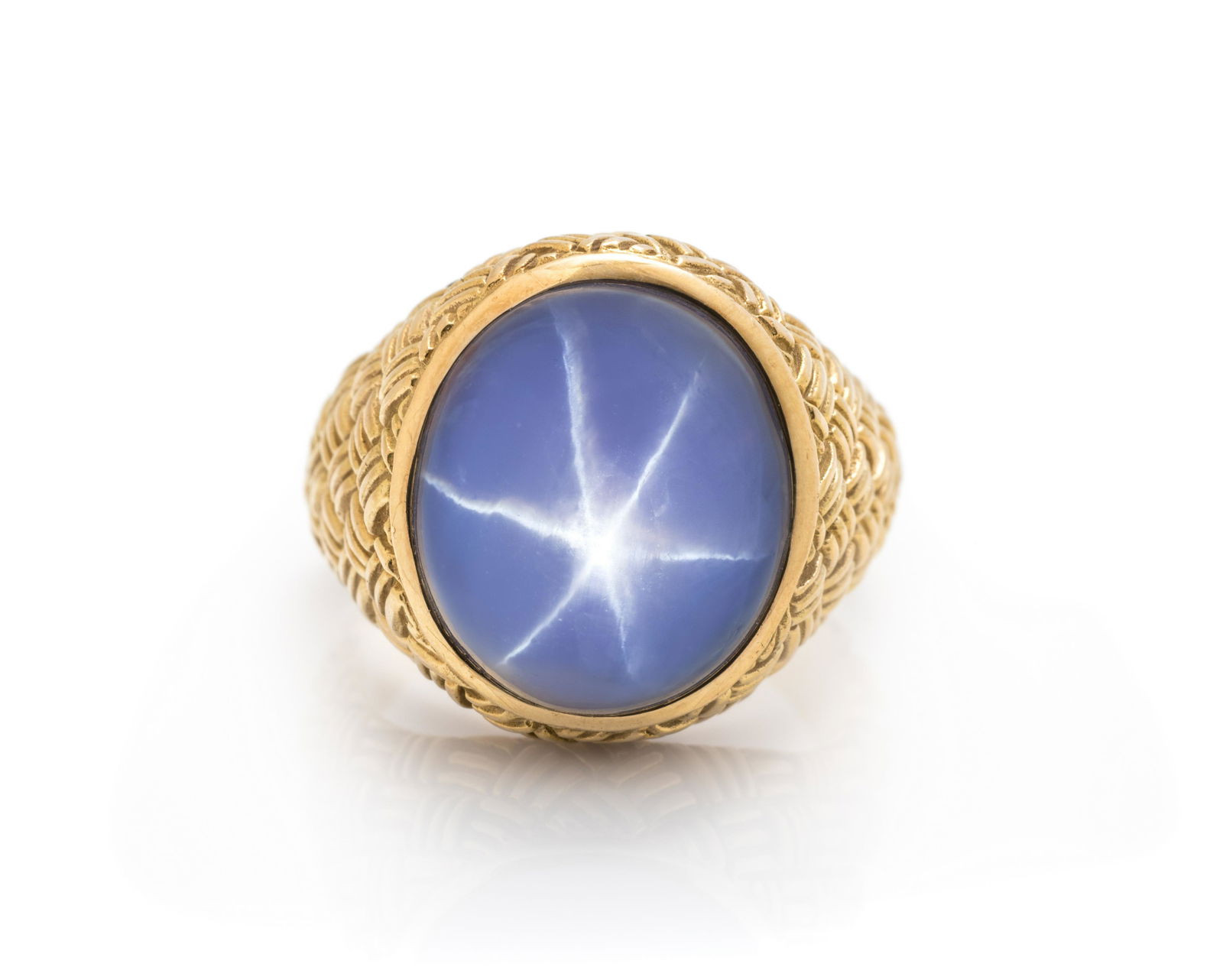 STAR SAPPHIRE RING: STAR SAPPHIRE RING Containing one oval shape cabochon cut star sapphire measuring approximately 15.50 x 13.50 x 13.20 mm. Mounted in yellow gold. 15.10 dwt.