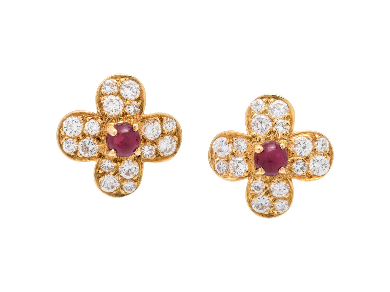 VAN CLEEF & ARPELS, RUBY AND DIAMOND 'TREFLE' EARCLIPS: VAN CLEEF & ARPELS, RUBY AND DIAMOND 'TREFLE' EARCLIPS Containing two round cabochon cut rubies measuring approximately 3.80 mm in diameter and 32 round brilliant cut diamonds weighing approximately 0