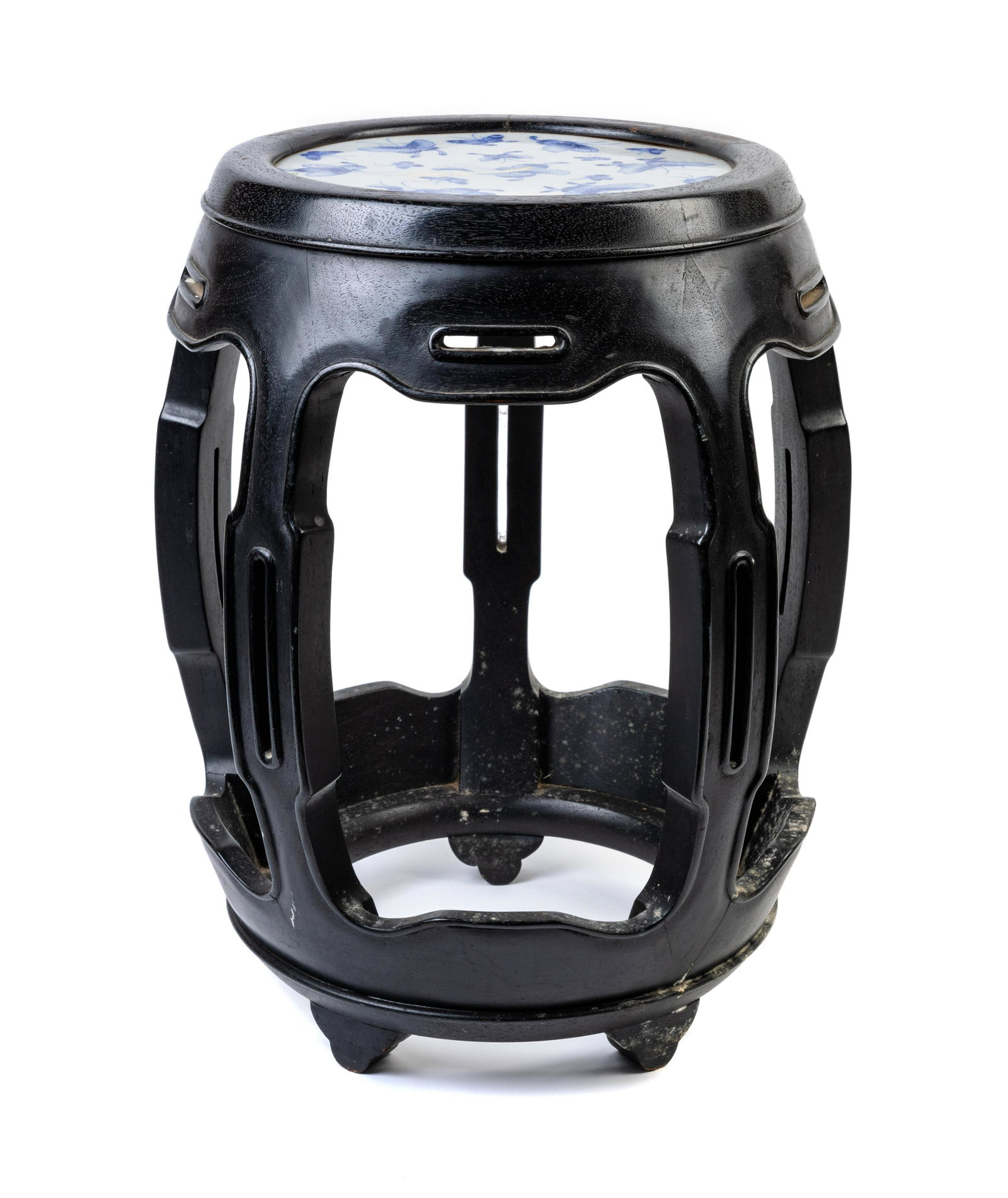A Blue and White Porcelain Inset Black Lacquered: A Blue and White Porcelain Inset Black Lacquered Elmwood Stool 20TH CENTURY Height 18 1/2 x diam 11 1/4 in., 47 x 28.6 cm. of barrel form, inset with a blue and white porcelain plaque decorated with f