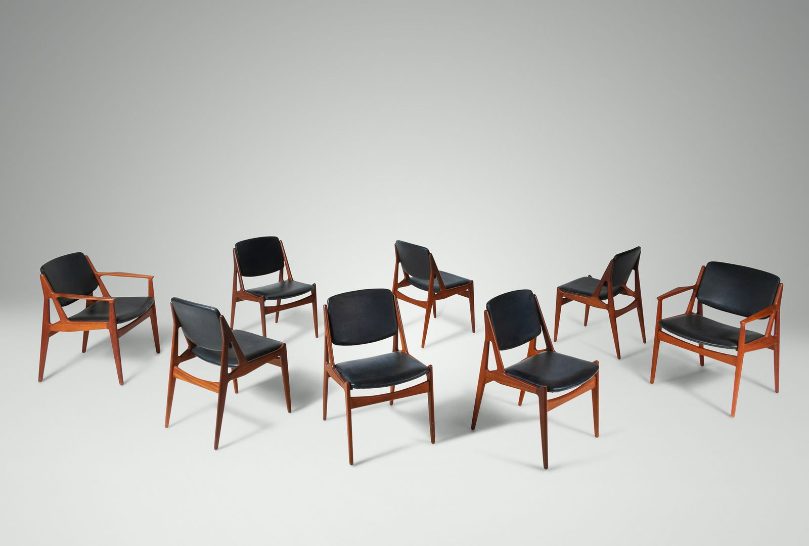 Arne Vodder (Danish, 1926-2009) Set of Eight Ellen: Arne Vodder (Danish, 1926-2009) Set of Eight Ellen Dining Chairs Vamo Mobelfabrik, Denmark teak, upholstery manufacturer's brand to underside H 30 5/8 x W 18 1/2 x D 22 inches | Armchairs, H 30 5/8 x