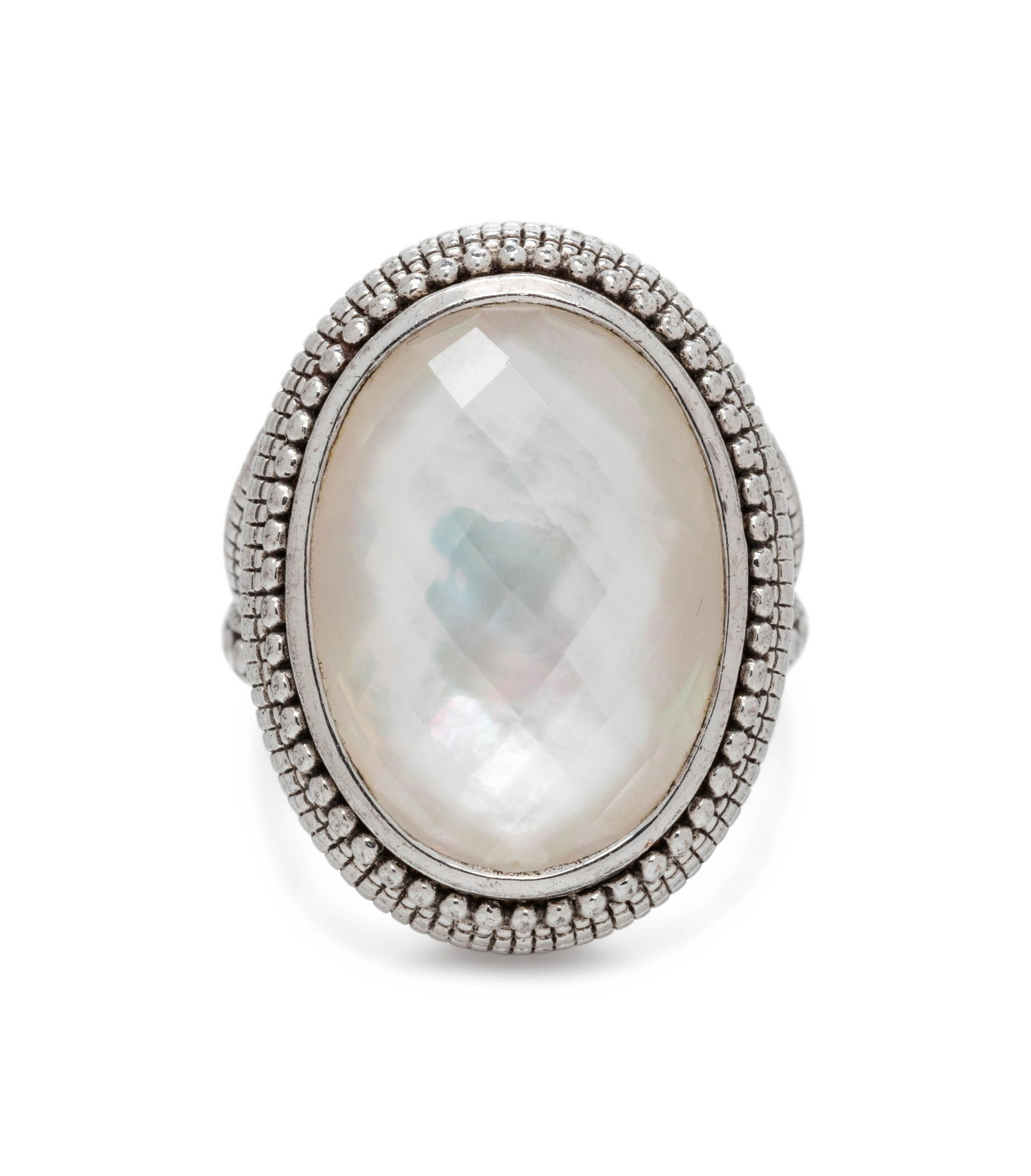 JUDITH RIPKA, MOTHER-OF-PEARL DOUBLET RING: JUDITH RIPKA, MOTHER-OF-PEARL DOUBLET RING Containing one oval shape checkerboard cut mother-of-pearl doublet measuring approximately 18.00 x 13.00 mm. Mounted in sterling silver. Stamp: JR 925. 6.05