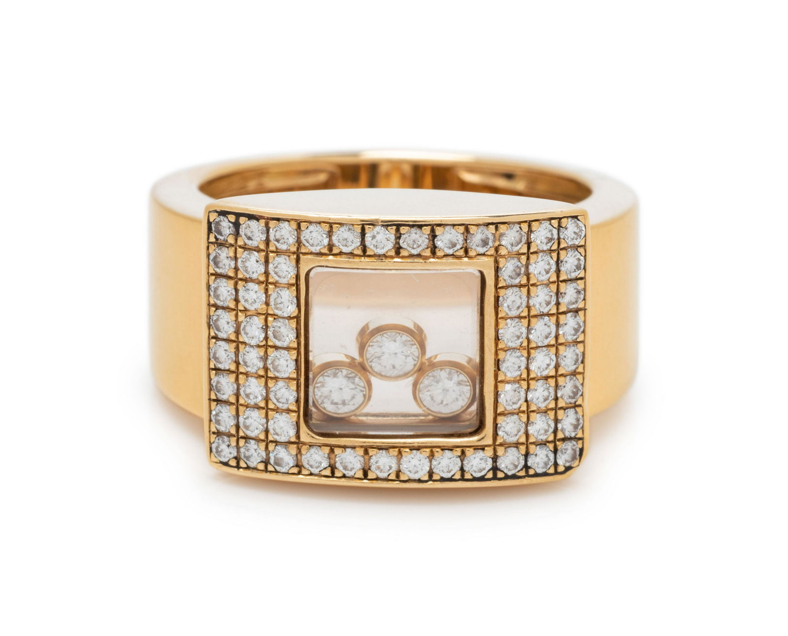 CHOPARD, YELLOW GOLD AND DIAMOND 'HAPPY DIAMONDS' RING: CHOPARD, YELLOW GOLD AND DIAMOND 'HAPPY DIAMONDS' RING Consisting of a glazed compartment enclosing three freely moving bezel set round brilliant cut diamonds weighing approximately 0.12 carat total s