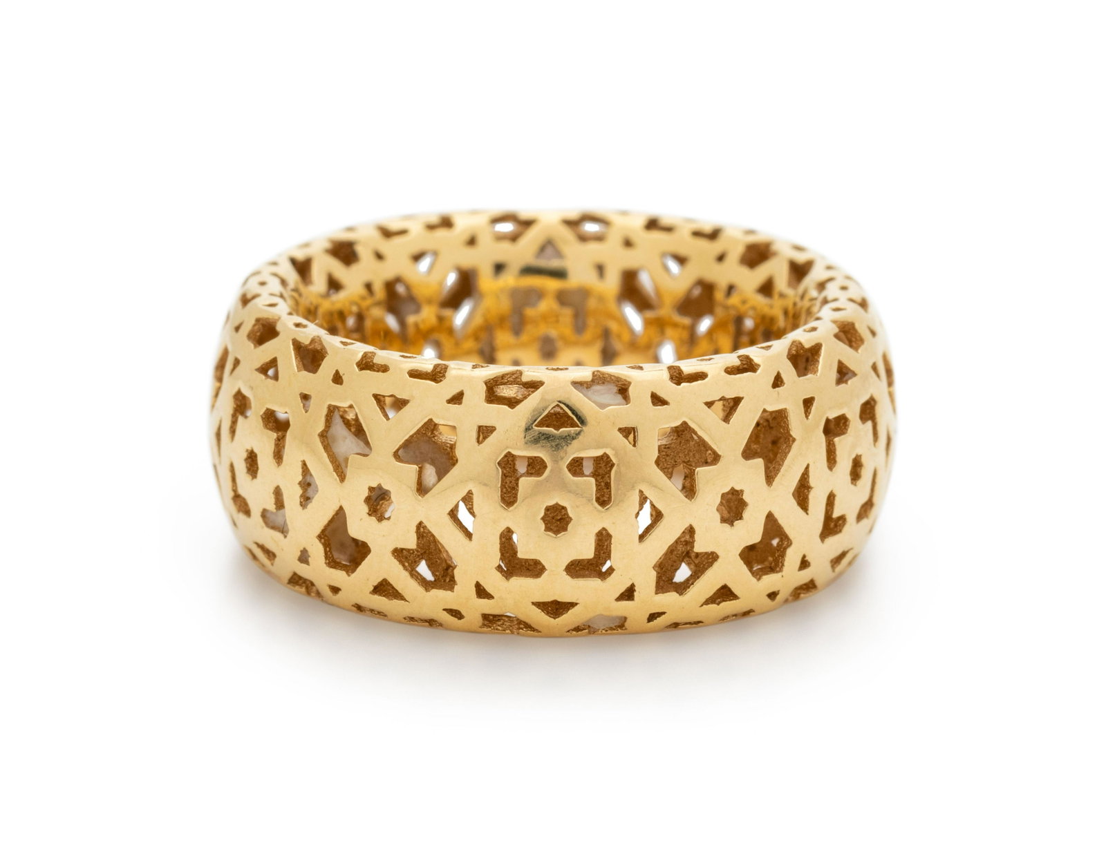 TIFFANY & CO., PALOMA PICASSO, YELLOW GOLD RING: TIFFANY & CO., PALOMA PICASSO, YELLOW GOLD RING With pierced decoration, measuring approximately 9.00 mm wide. Stamp: PALOMA PICASSO TIFFANY & CO. 750 ITALY. 5.30 dwt. Property from the Collection of 