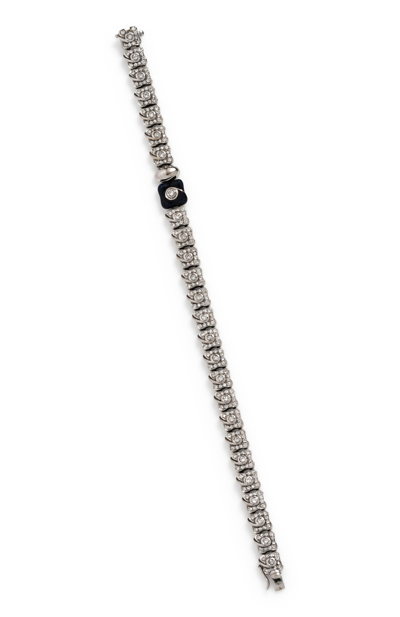 DIAMOND AND ENAMEL BRACELET: DIAMOND AND ENAMEL BRACELET Containing numerous round brilliant cut diamonds weighing approximately 1.50 carats total and black enamel section. Mounted in white gold. 13.90 dwt. Property from the Coll