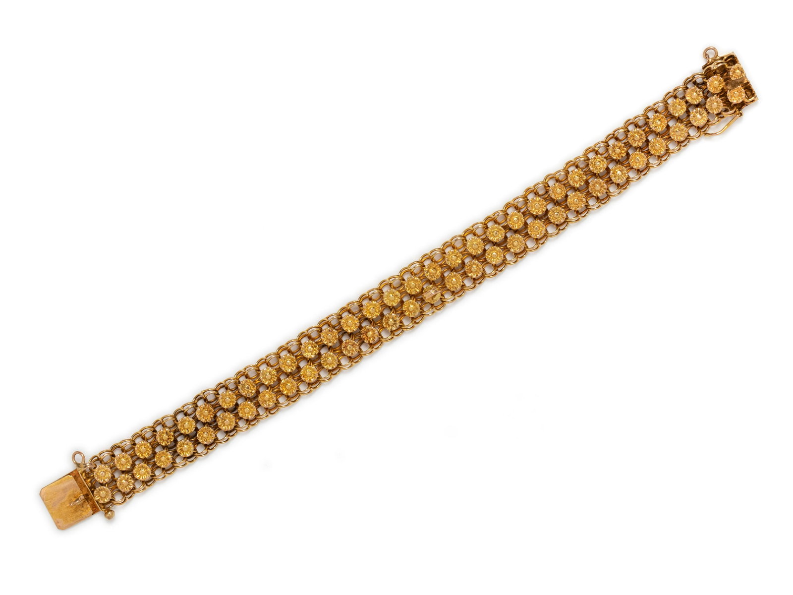 YELLOW GOLD BRACELET: YELLOW GOLD BRACELET Consisting of a link bracelet with florettes measuring approximately 13.00 mm wide, with later attached bail in the center and safety chain. 13.20 dwt.