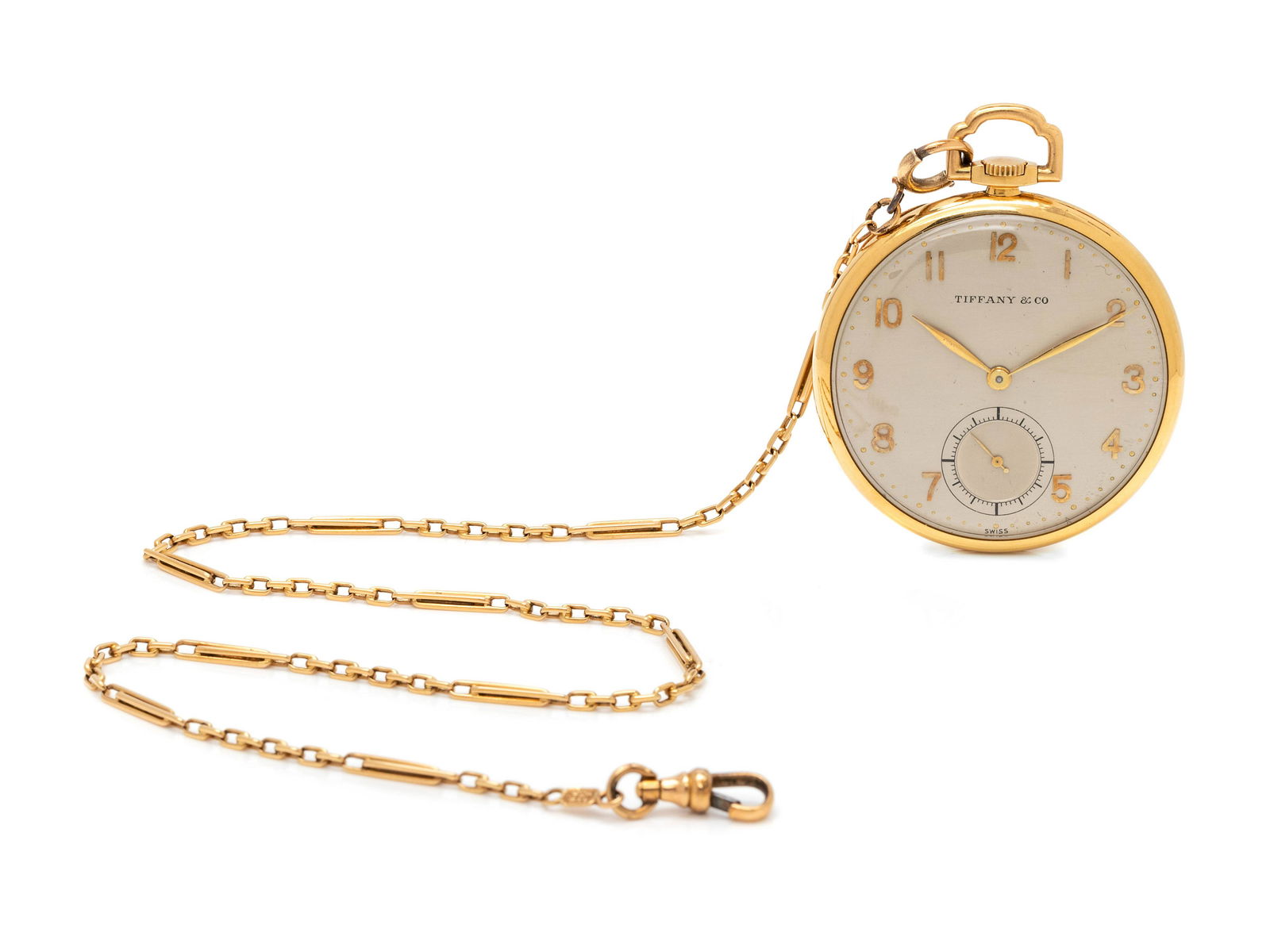 TIFFANY & CO., 18K YELLOW GOLD OPEN FACE POCKET WATCH: TIFFANY & CO., 18K YELLOW GOLD OPEN FACE POCKET WATCH 44.00 mm case diameter, matte silvered single-sunk dial signed Tiffany & Co, applied gold Arabic numerals, gold feuille hands, subdial for seconds