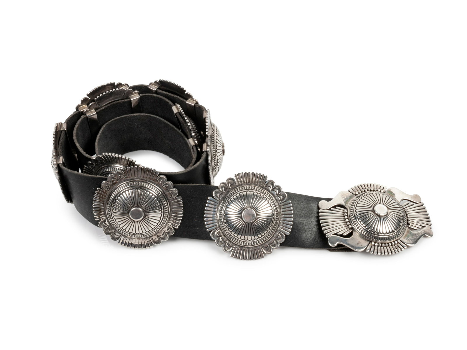 Howard Nelson (DINE, B. 1951) Sterling Silver Concho: Howard Nelson (DINE, B. 1951) Sterling Silver Concho Belt signed Nelson and marked STERLING (buckle) height 3 inches x length 4 inches; (nine conchas) diameter 3 inches, 476.6 dwt. Property sold to be