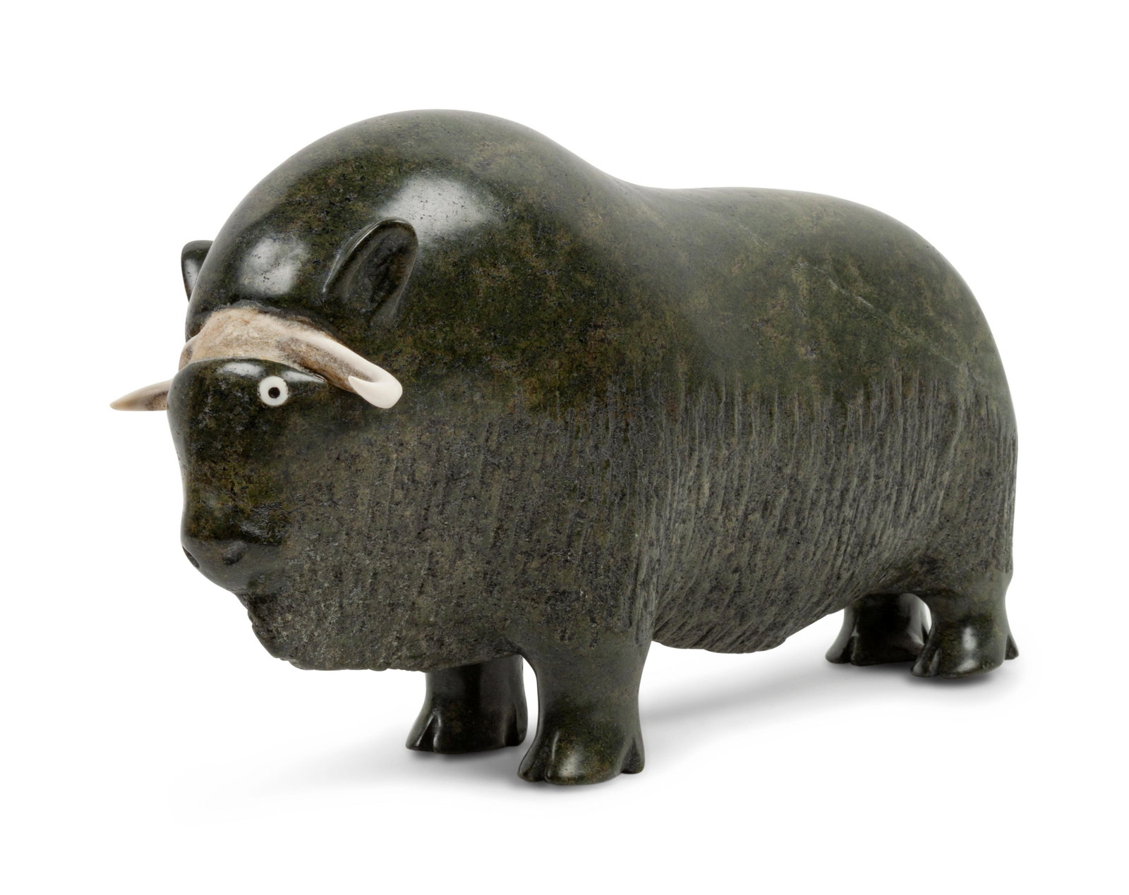 Nuveeya Ipellie (INUIT, 1920-2019) Soapstone Sculpture,: Nuveeya Ipellie (INUIT, 1920-2019) Soapstone Sculpture, Muskox signed in Roman length 14 inches Property from the Dewar Family Collection, Overland Park, KS