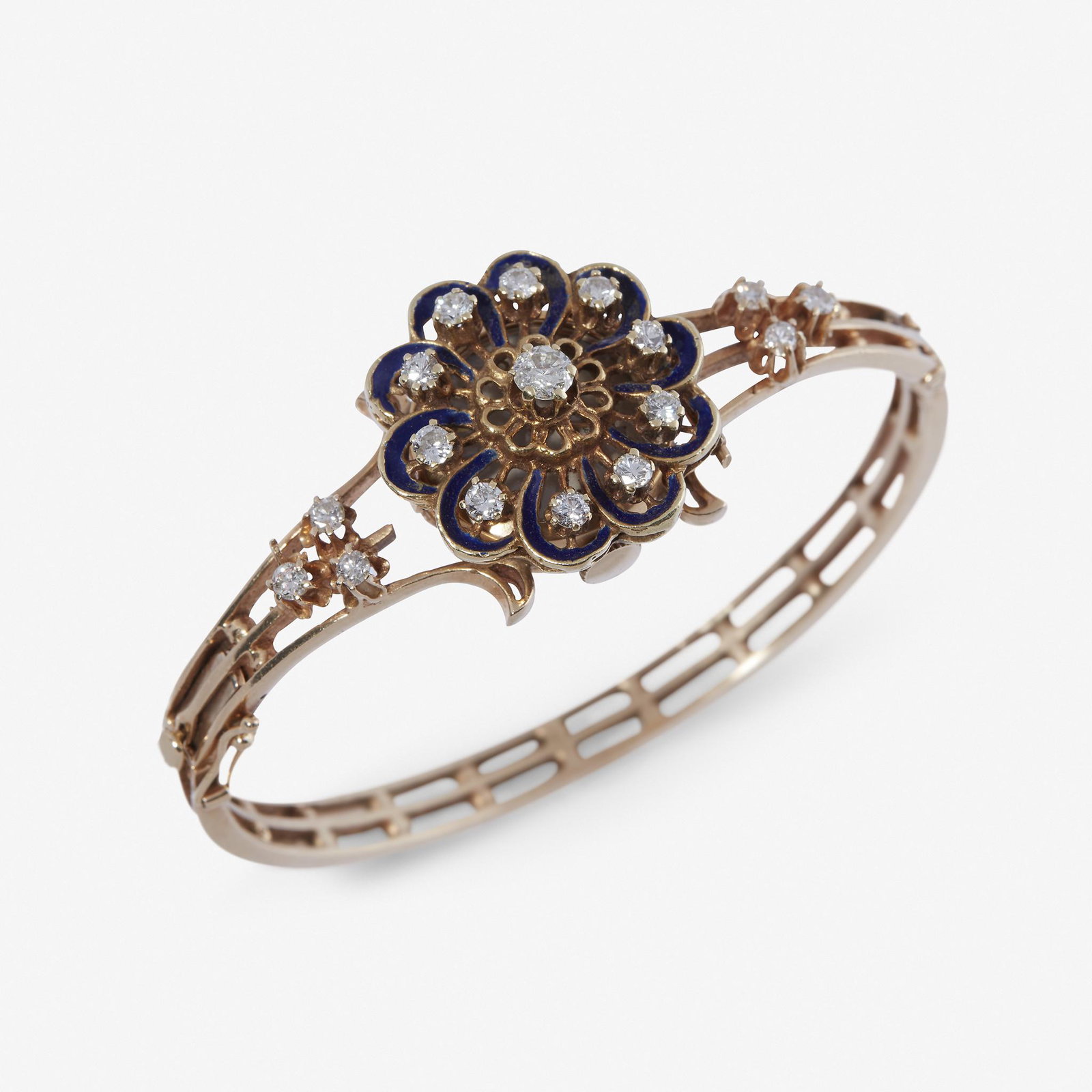 A diamond and enameled fourteen karat gold hidden watch: A diamond and enameled fourteen karat gold hidden watch bracelet Lucerne designed as a circular-cut diamond and cobalt blue enameled rosette panel, concealing a round white dial with applied gold dash