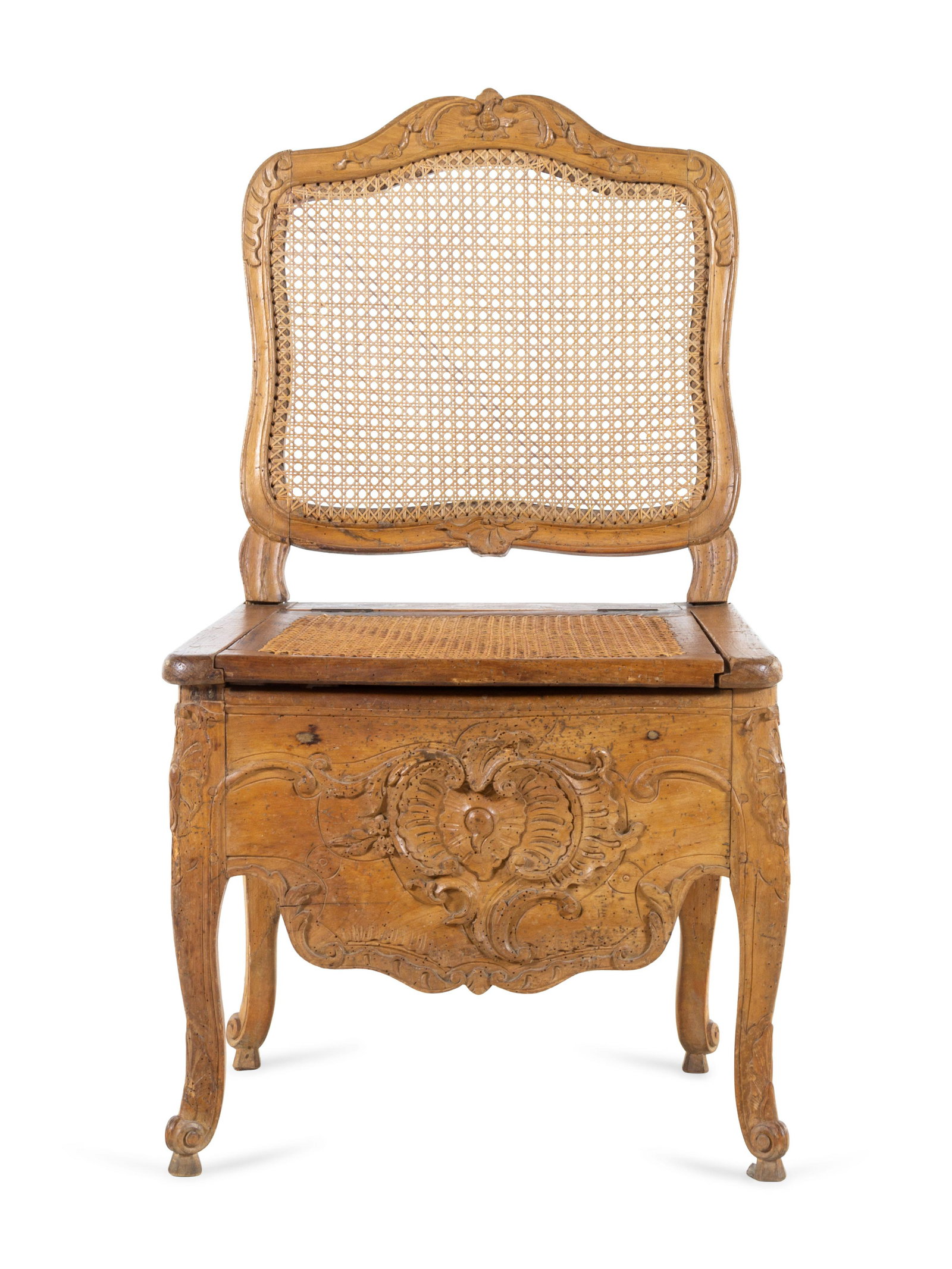 A Louis XV Provincial Carved Fruitwood Commode Chair: A Louis XV Provincial Carved Fruitwood Commode Chair 18th/19th Century Height 39 3/4 inches.