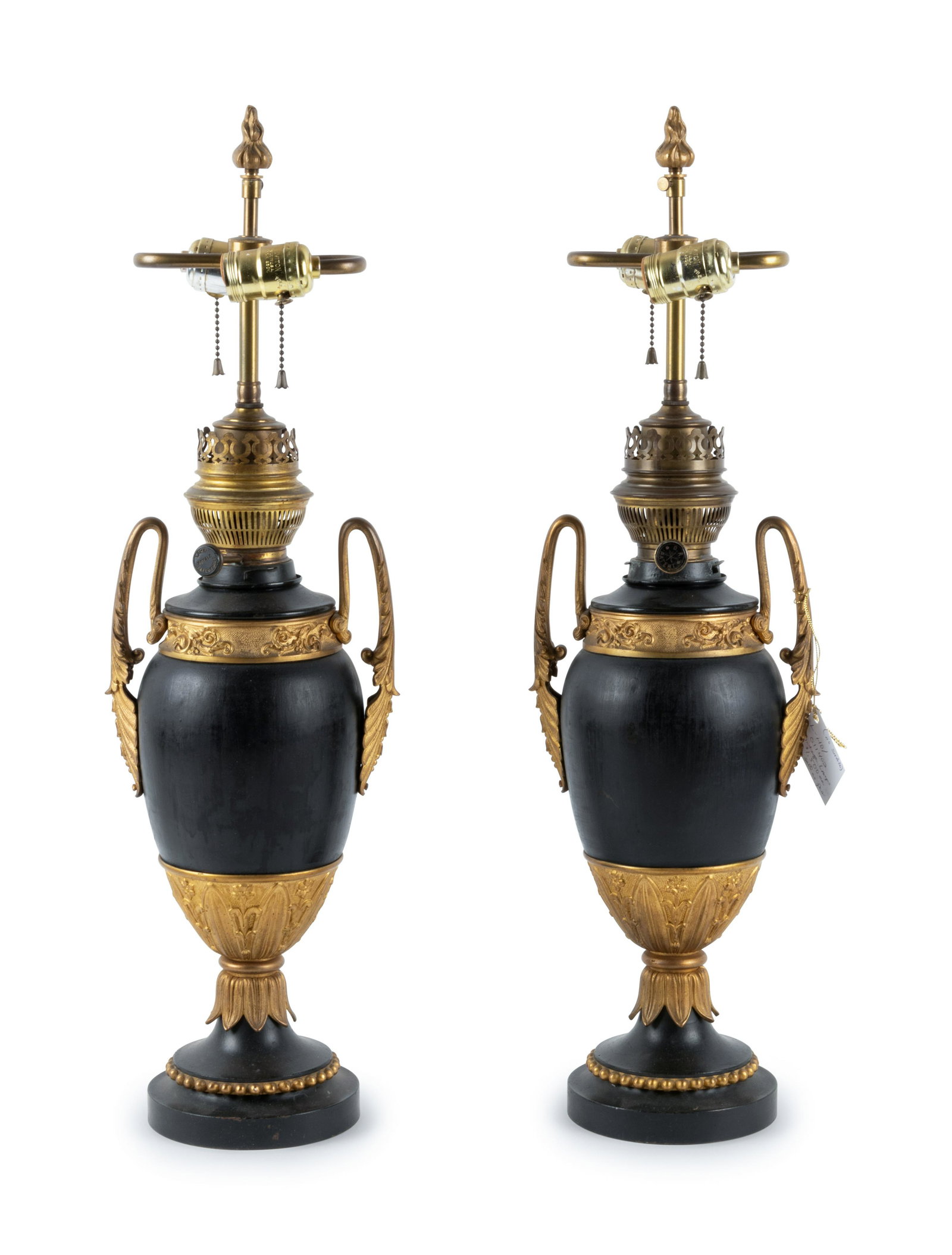 A Pair of Continental Neoclassical Style Urn-Form: A Pair of Continental Neoclassical Style Urn-Form Electrified Oil Lamps Late 19th Century knobs marked Lampe Royale Farenthold. Height 19 inches. Property from the Collection of Susan Kroeger, Ltd., 