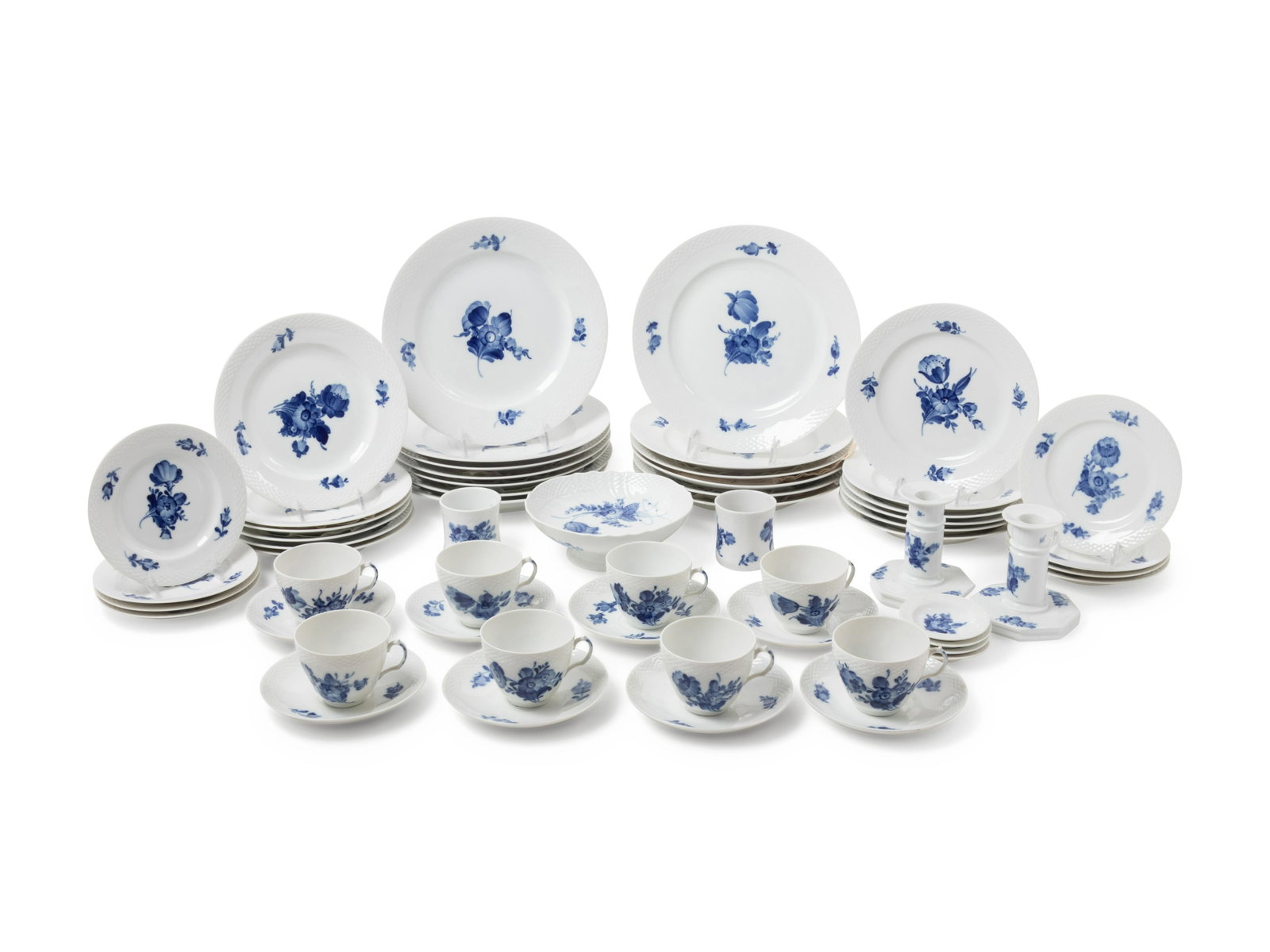 A Royal Copenhagen Blue Flower Porcelain Service: A Royal Copenhagen Blue Flower Porcelain Service Second Half 20th Century comprising 13 dinner plates, 12 salad plates, 8 bread plates, 8 teacups, 9 saucers, 4 butter pads, 2 condiment pots, 1 compote