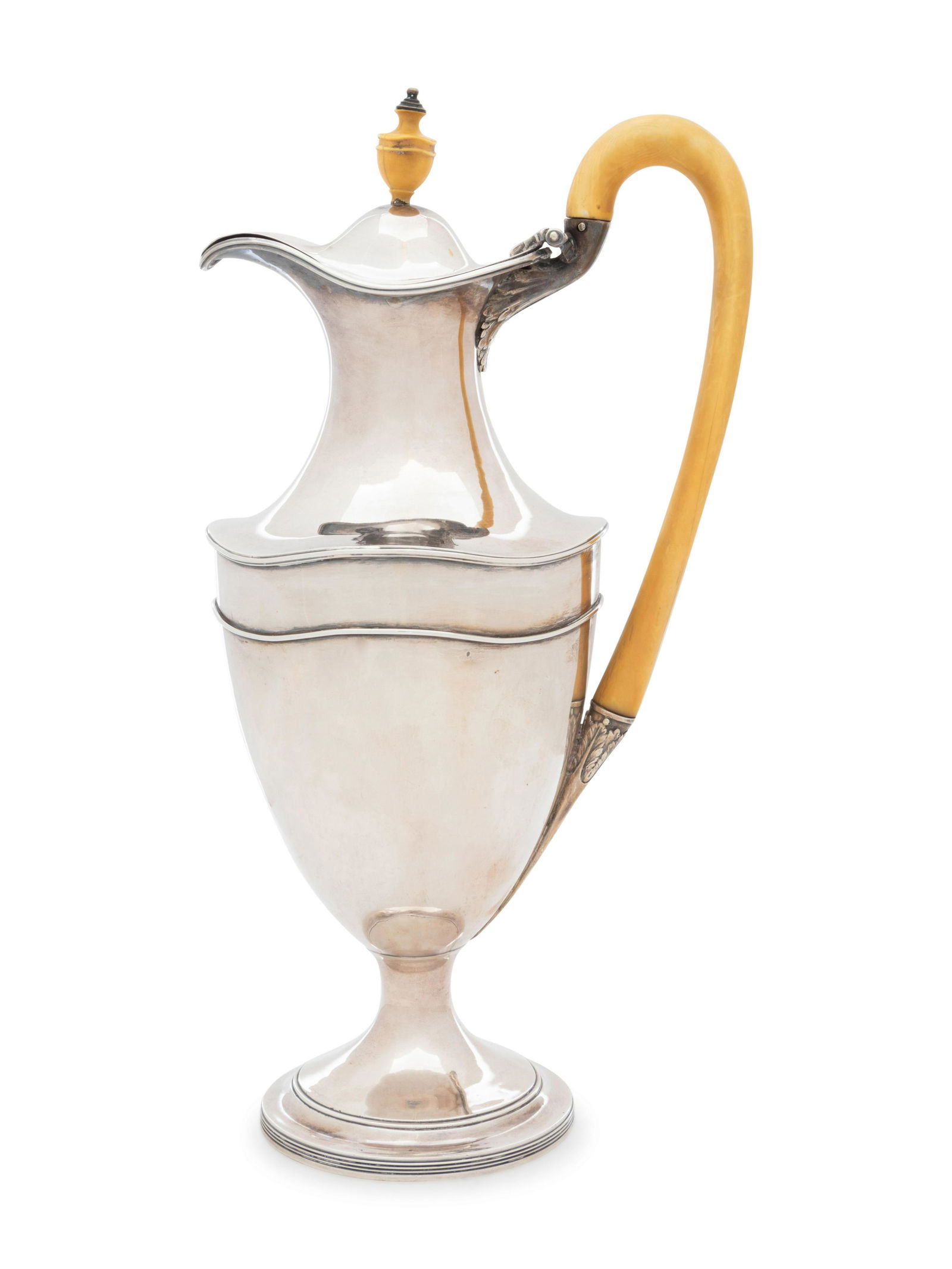 A George III Silver Wine Ewer: A George III Silver Wine Ewer Hester Bateman, London, 1786 the body with an applied undulating band to the shoulder. hallmarked for Sterling on neck 23 ozt 1 dwt gross Height 13 inches.