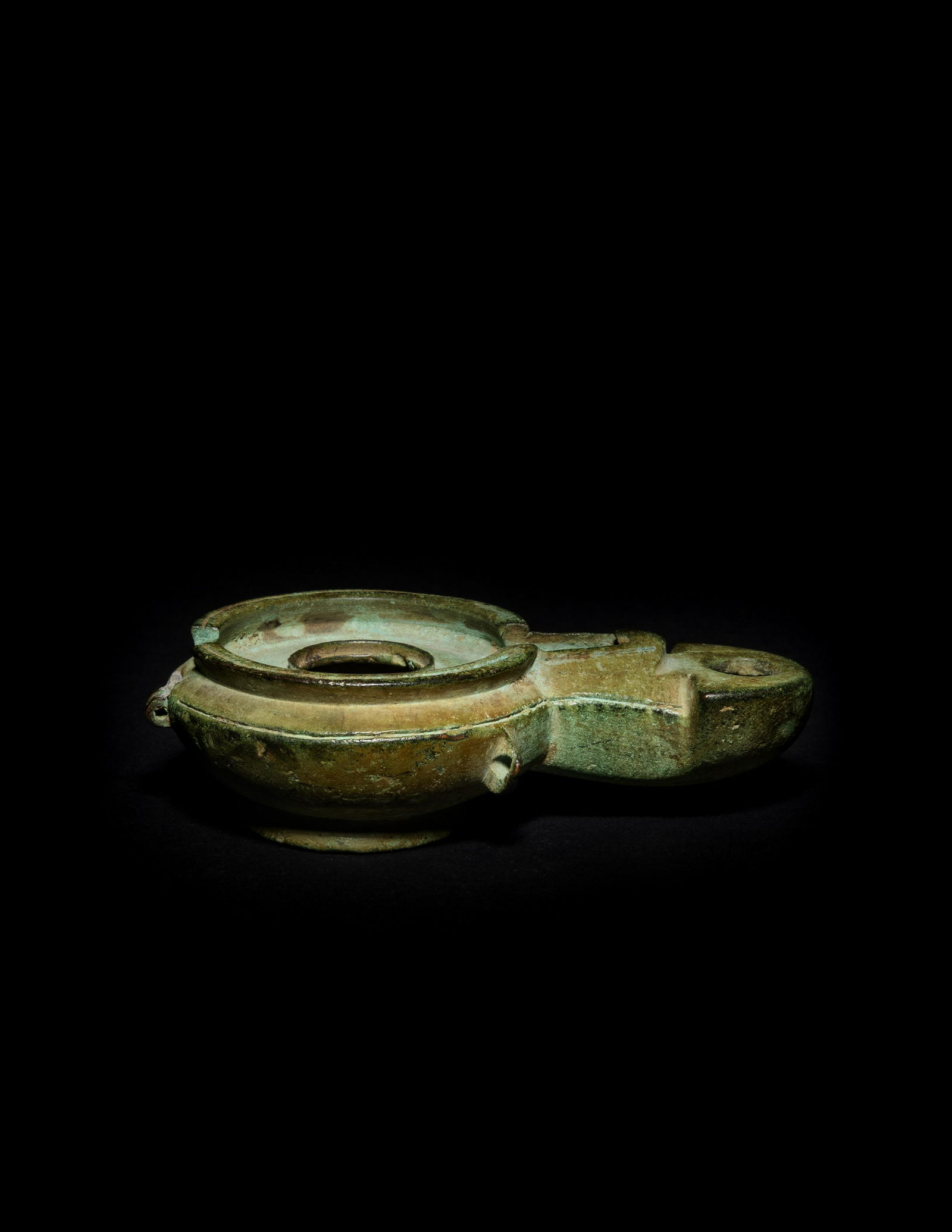 A Roman Bronze Oil Lamp: A Roman Bronze Oil Lamp Circa 1st Century A.D. Width 4 1/2 inches. Property from the George R. Francoeur Trust, Bloomfield Hills, Michigan, sold to benefit the George R. Francoeur Scholarship Fund at