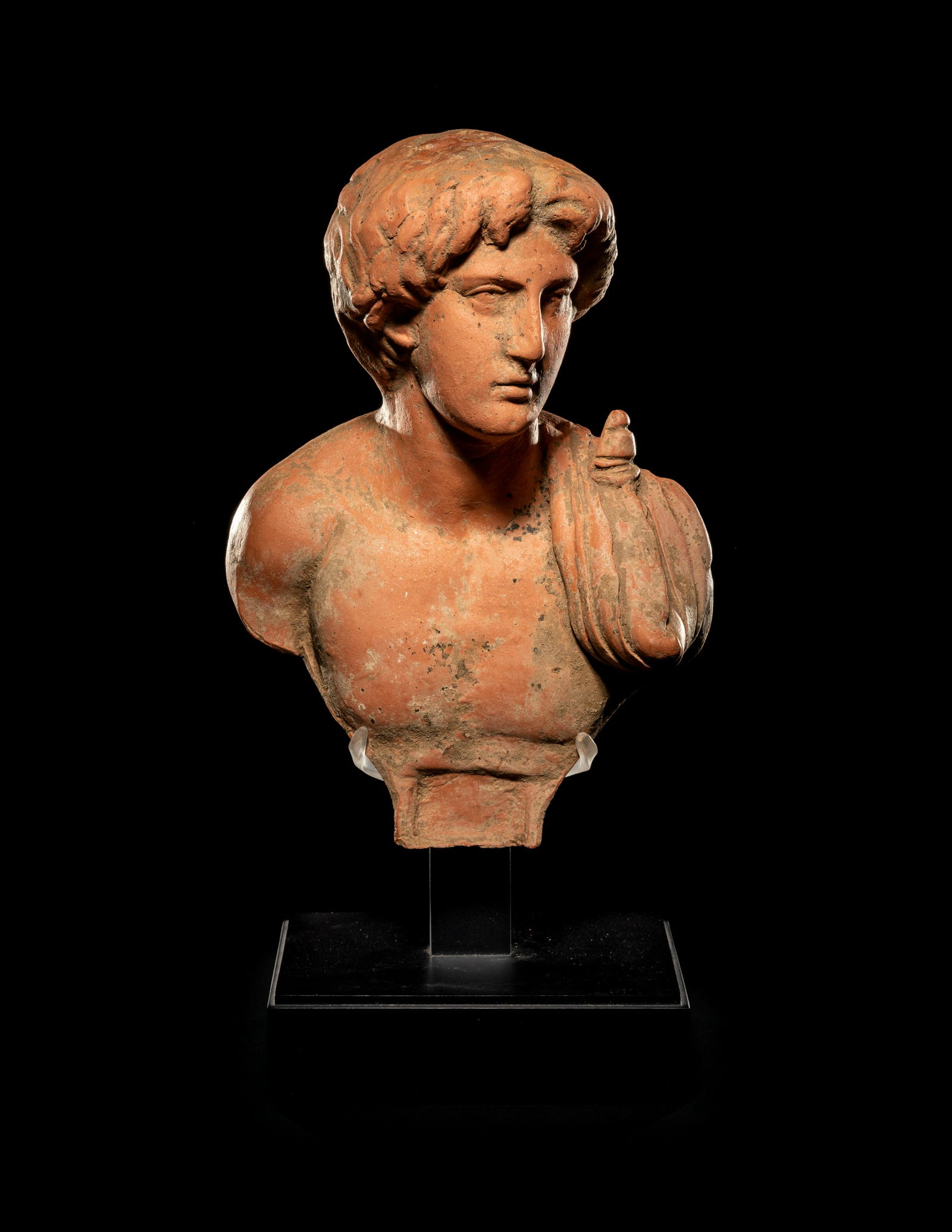A Graeco-Roman Terra Cotta Bust, Possibly Depicting (1 of 3)