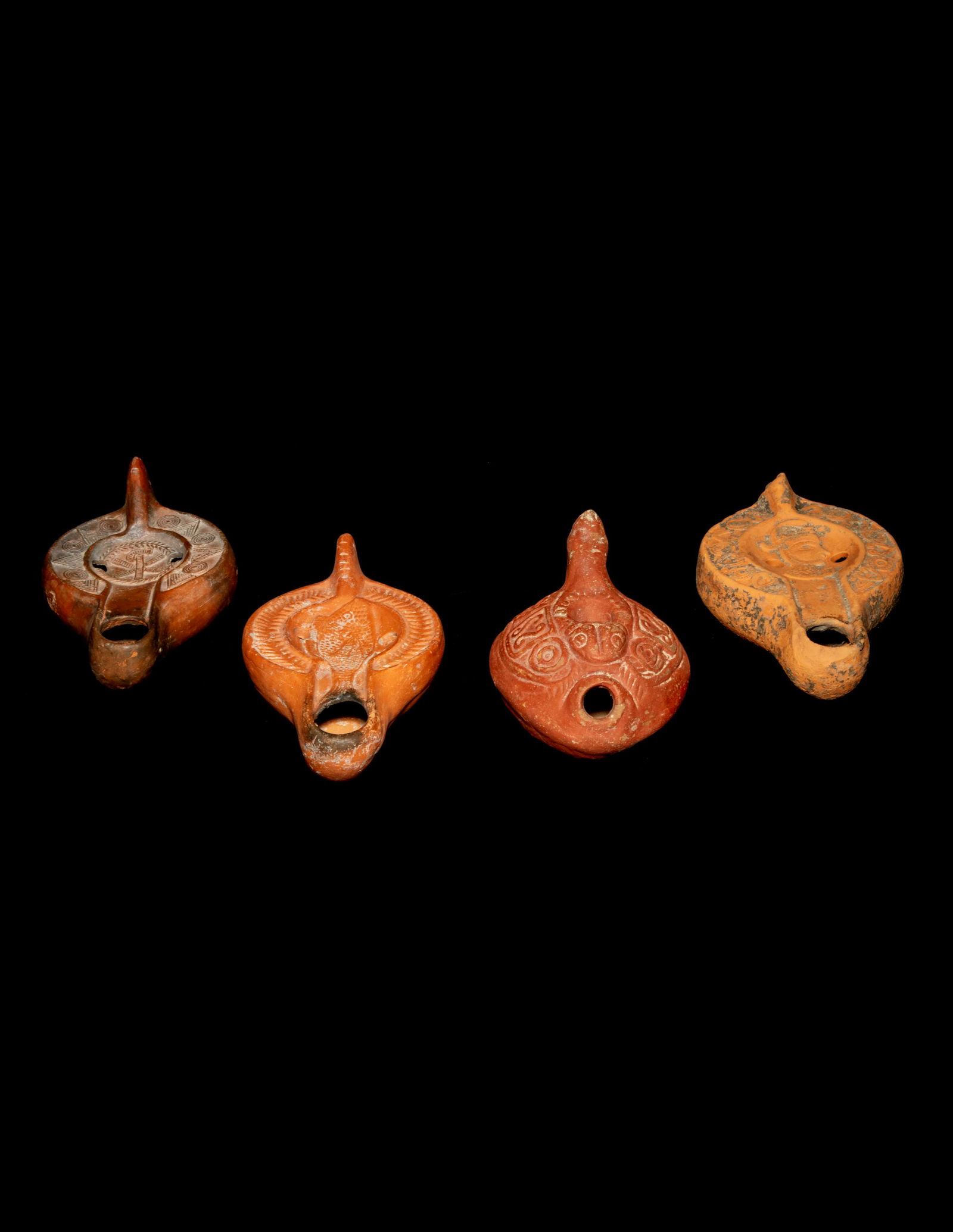 Four Roman Molded Terra Cotta Oil Lamps (1 of 3)