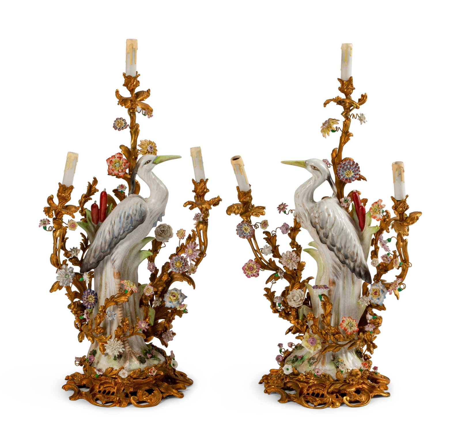 A Pair of Louis XV Style Gilt-Bronze and Porcelain: A Pair of Louis XV Style Gilt-Bronze and Porcelain Three-Light Candelabra Height 35 x width 18 x depth 12 inches.