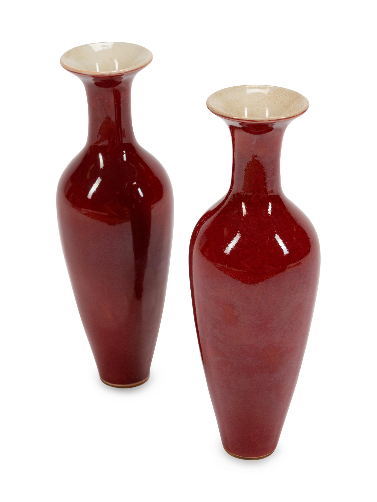 A Pair of Chinese Sang de Boeuf-Glazed Porcelain: A Pair of Chinese Sang de Boeuf-Glazed Porcelain Shouldered Ovoid Vases Height 9 x diameter 3 inches.
