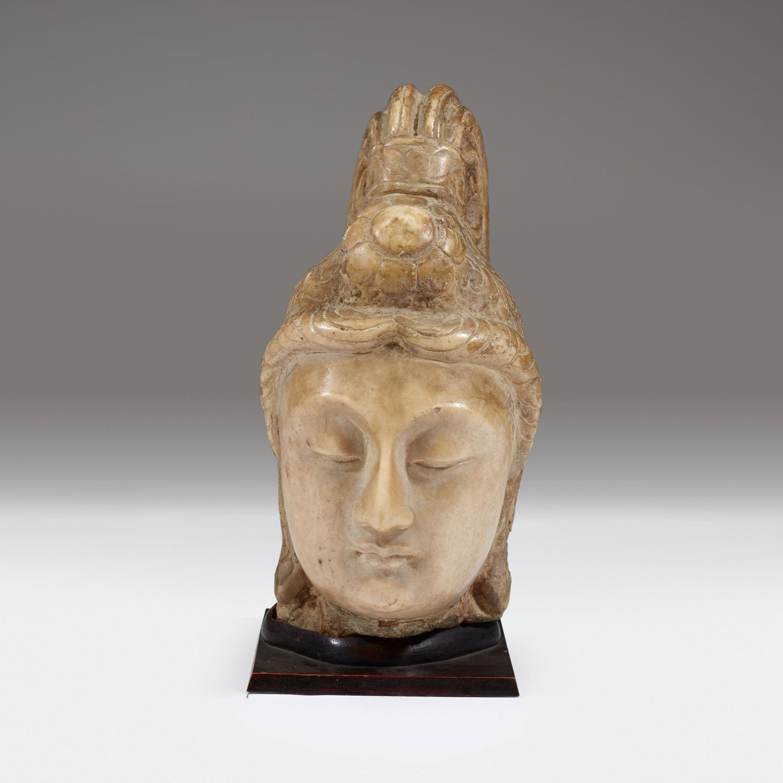 A Chinese carved stone head of bodhisattva, Possibly (1 of 2)
