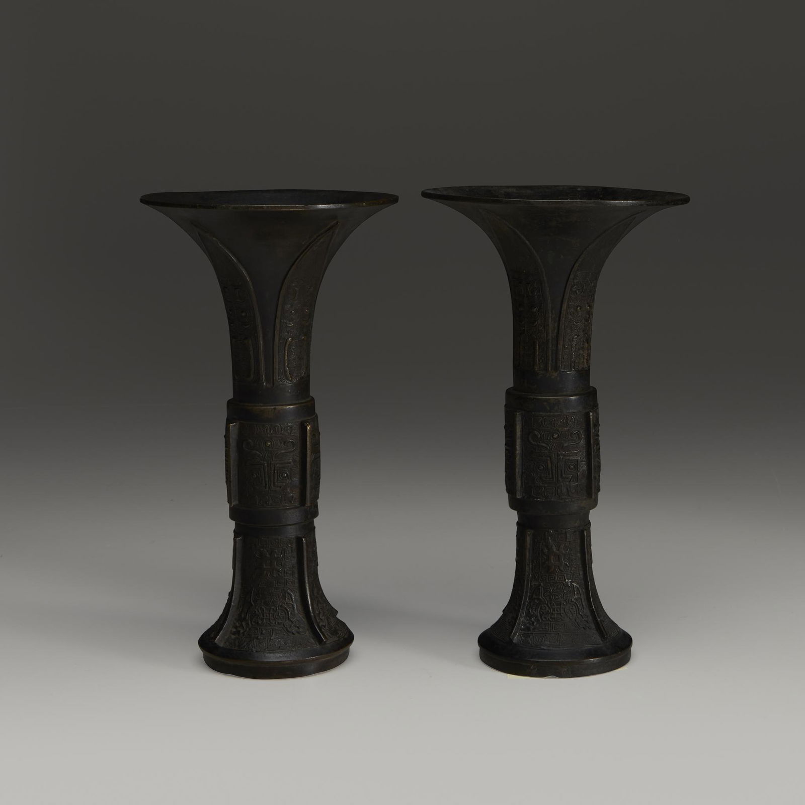 An associated pair of Chinese patinated bronze (1 of 1)