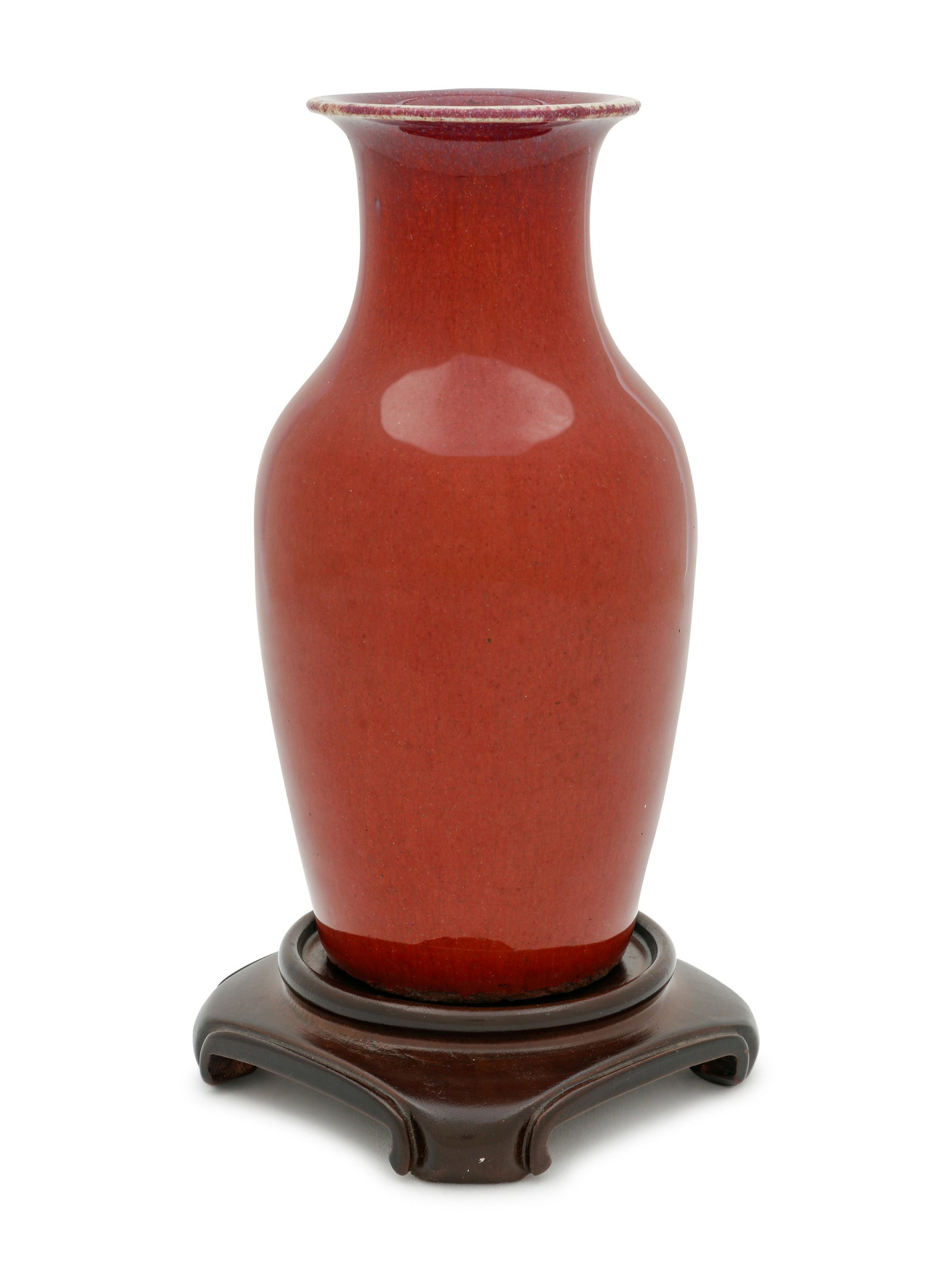 A Chinese Sang-de-Boeuf Glazed Porcelain Baluster Vase: A Chinese Sang-de-Boeuf Glazed Porcelain Baluster Vase LATE 19TH/20TH CENTURY with high sides narrowing to sloping shoulders and everted mouth him, covered in a warm glazed and raised above a fitted h