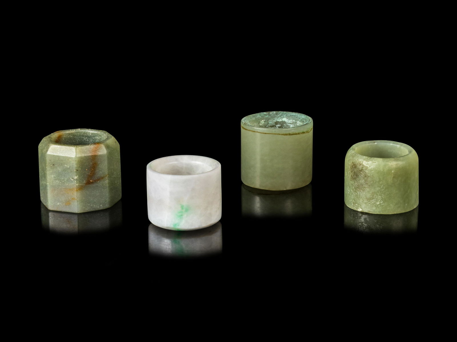 Four Chinese Jade and Jadiete Archer's Rings Average (1 of 1)