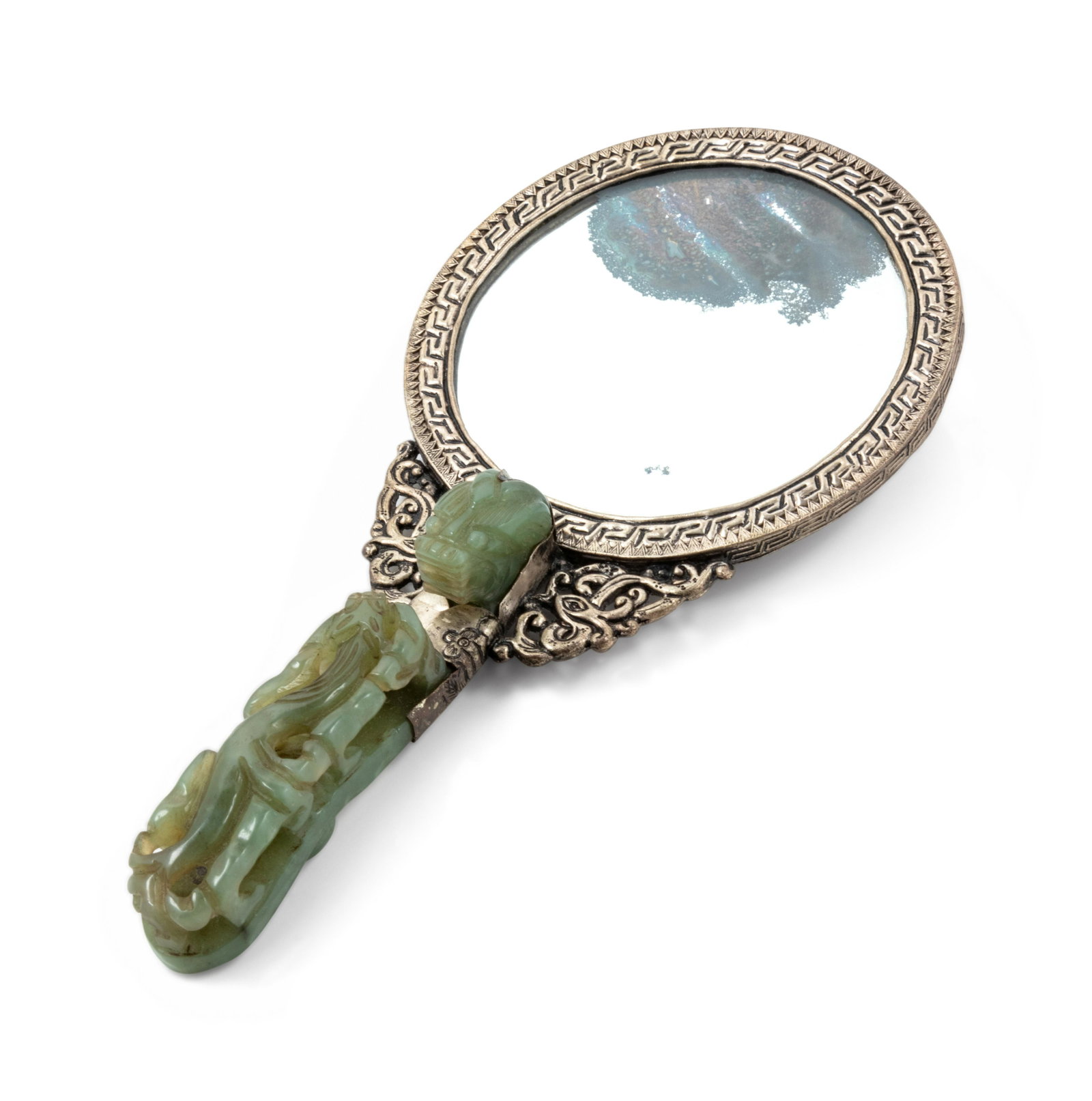 A Chinese Jade and Hardstone Inset Mirror Length 9 in.,: A Chinese Jade and Hardstone Inset Mirror LATE 19TH/EARLY 20TH CENTURY the reverse inset with pendant and cabachon, the handle comprised of a chilong form belt buckle. Length 9 in., 23 cm.