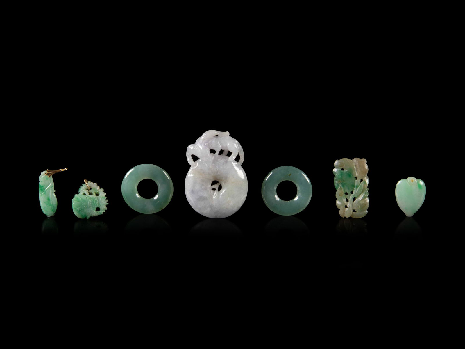 Seven Chinese Jadeite Pendants Length of largest 1 1/2 (1 of 2)