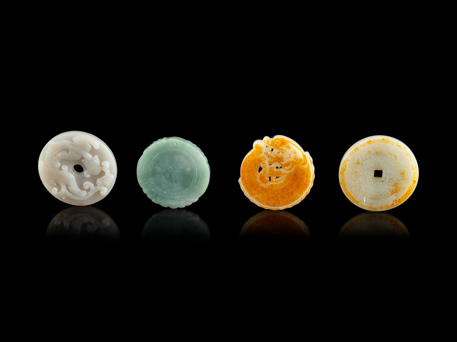 Four Chinese Jade and Jadeite Circular Pendants  (1 of 2)
