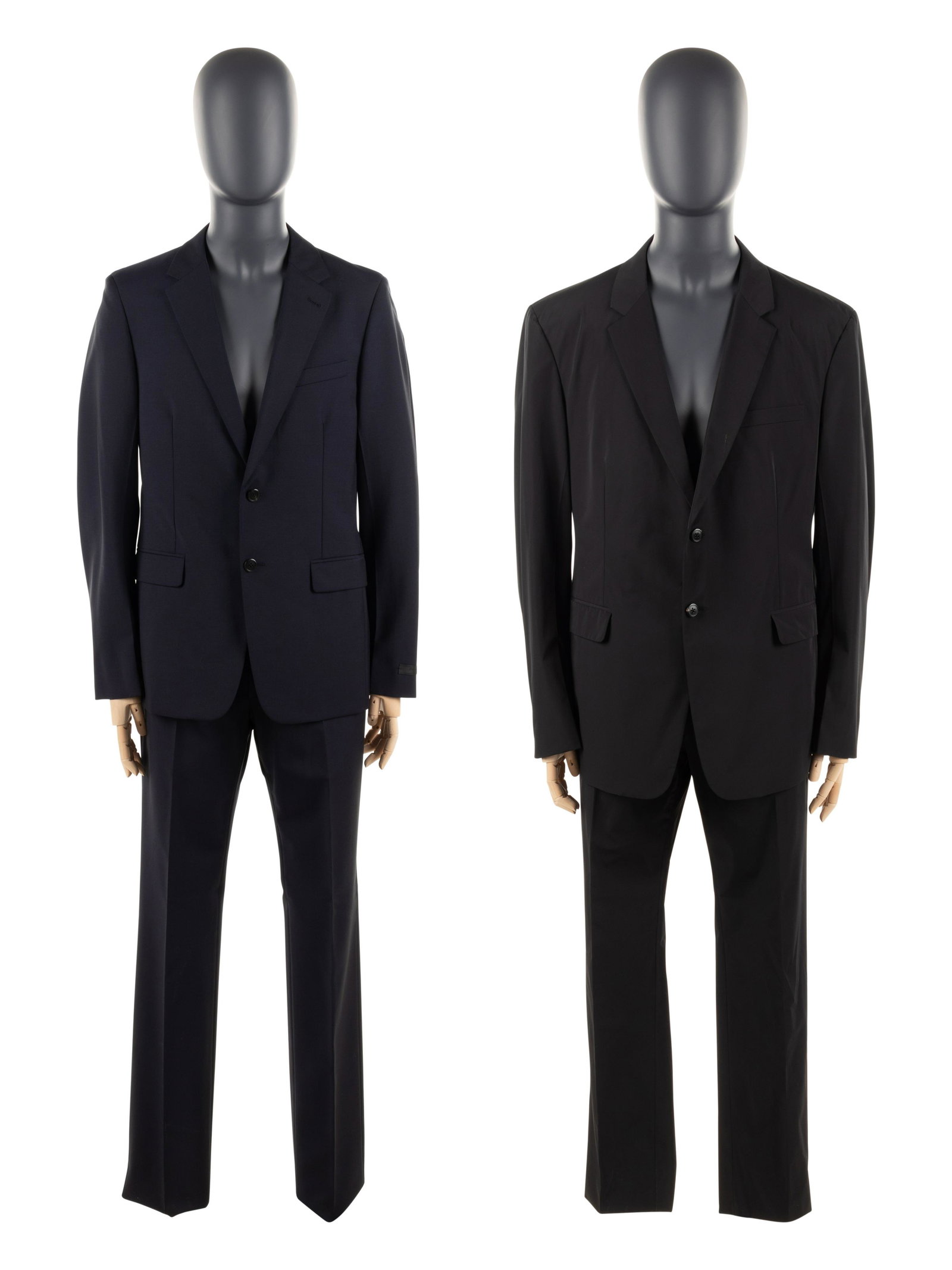 Two Prada Men's Suits, c.2017: Two Prada Men's Suits, c.2017 BNY 61, 79 This lot includes two 2-piece men's designer suits. THE FIRST Navy wool blend two-piece suit with slim cut jacket and paired with matching button-fly tro