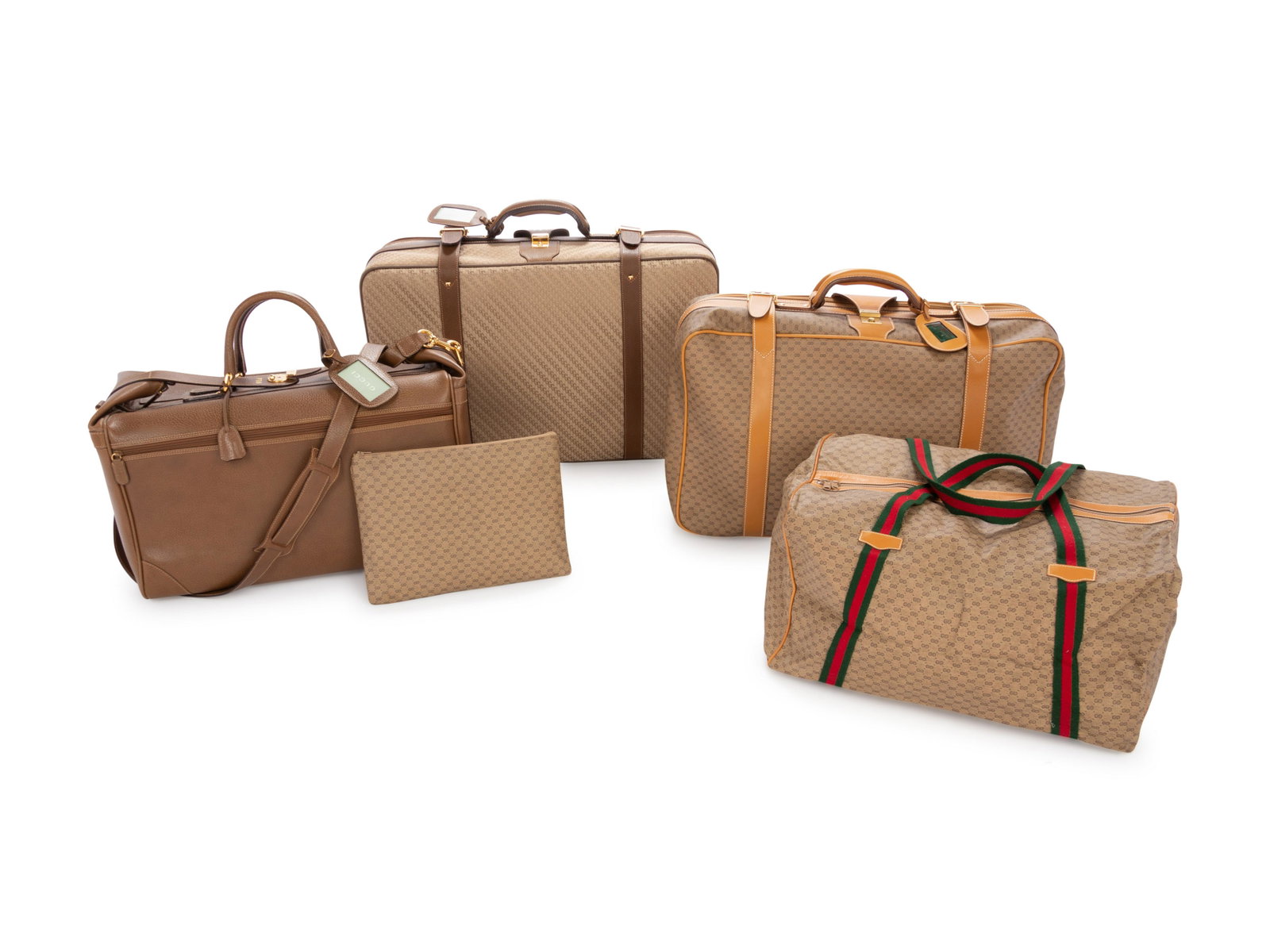 Group of Five Vintage Gucci Travel Items, 1970-80s: Group of Five Vintage Gucci Travel Items, 1970-80s This lot includes five travel items. THE FIRST A brown leather doctor bag with goldtone hardware and detachable leather shoulder strap. Goldton