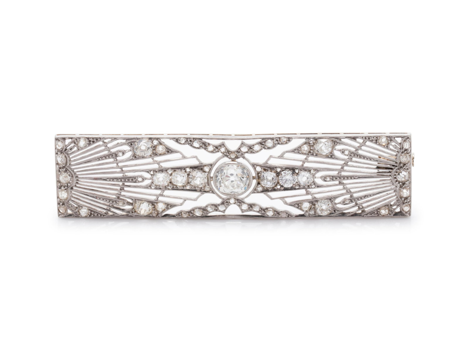 EDWARDIAN, DIAMOND BROOCH: EDWARDIAN, DIAMOND BROOCH Containing one old mine cut diamond weighing approximately 1.20 carats and numerous old mine, rose and mixed cut diamonds. Mounted in platinum topped gold. 7.30 dwt.