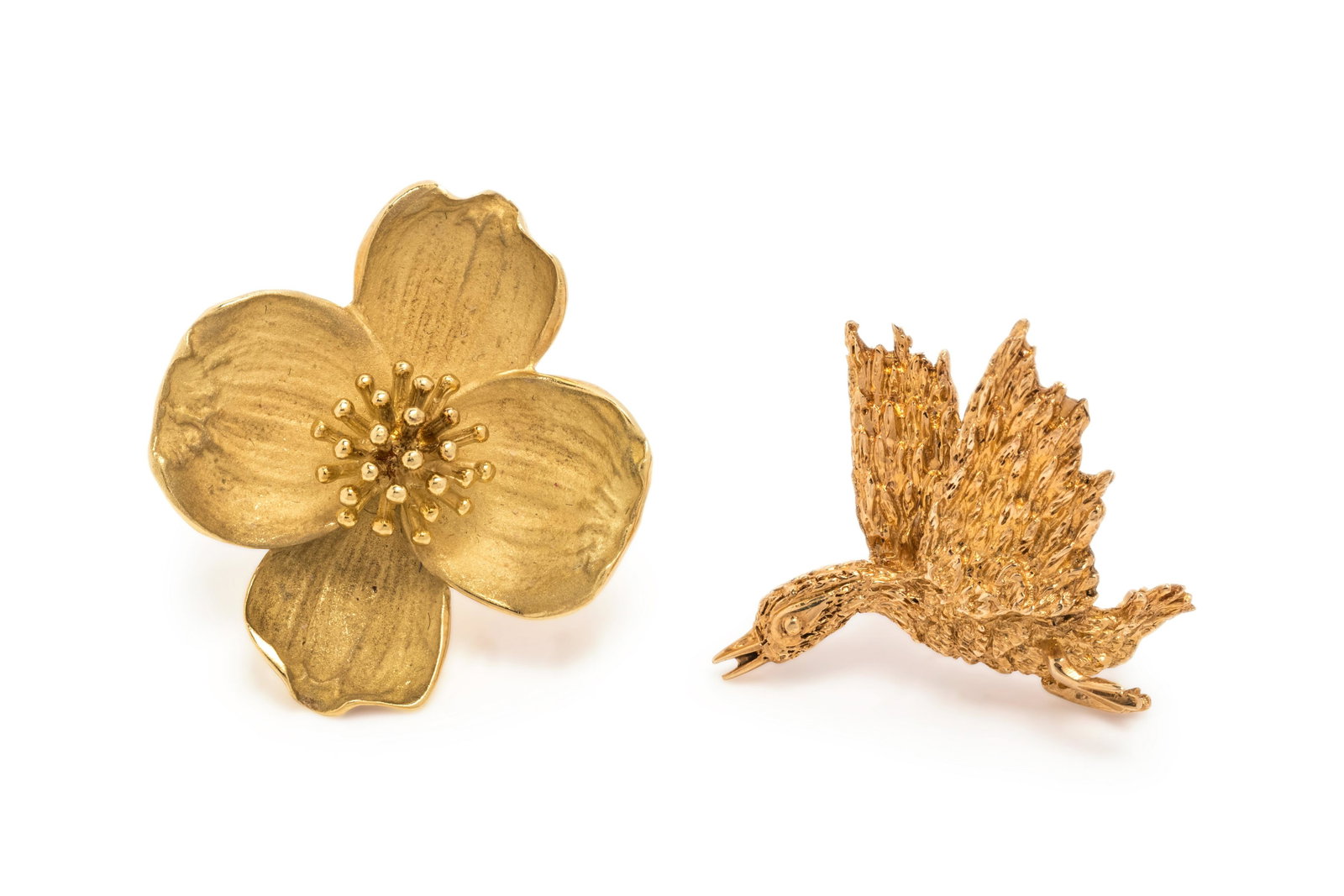 COLLECTION OF YELLOW GOLD BROOCHES: COLLECTION OF YELLOW GOLD BROOCHES Consisting of a matte and high polish flower pendant/brooch, together with a textured goose brooch. 15.15 dwt.