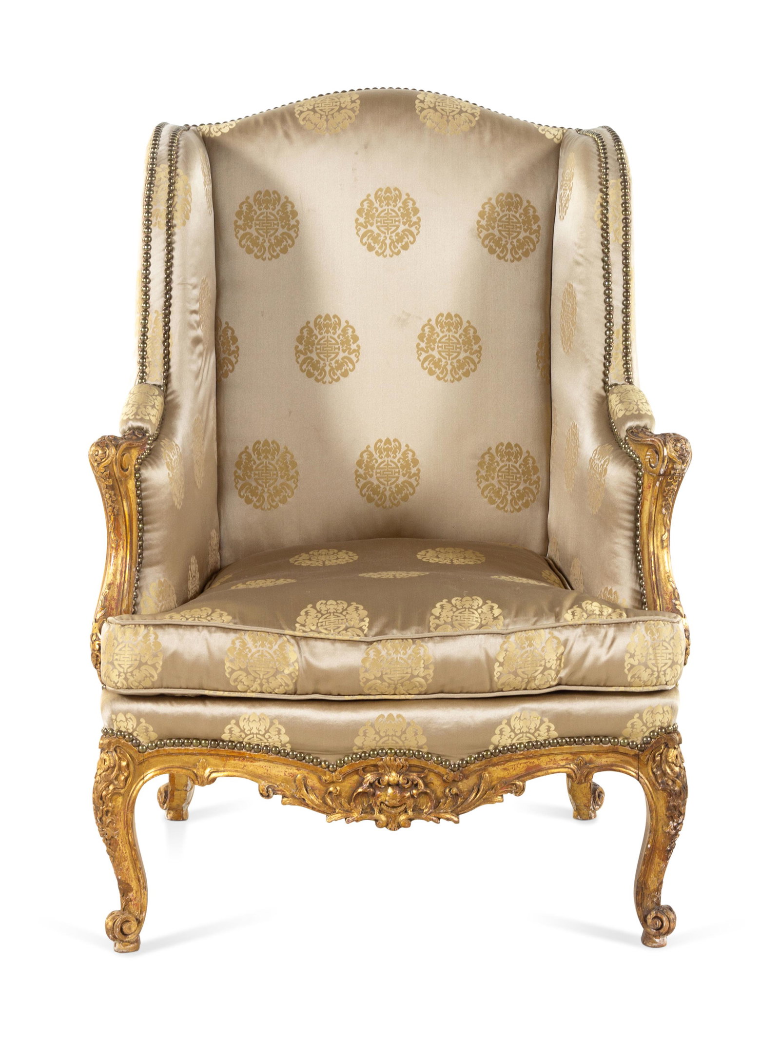 A Louis XV Style Carved Giltwood Bergere a Oreilles: A Louis XV Style Carved Giltwood Bergere a Oreilles 20th Century Height 41 1/2 x width 31 x depth 31 inches. Property from the Collection of Don and Carolyn Kirkpatrick, Little Rock, Arkansas