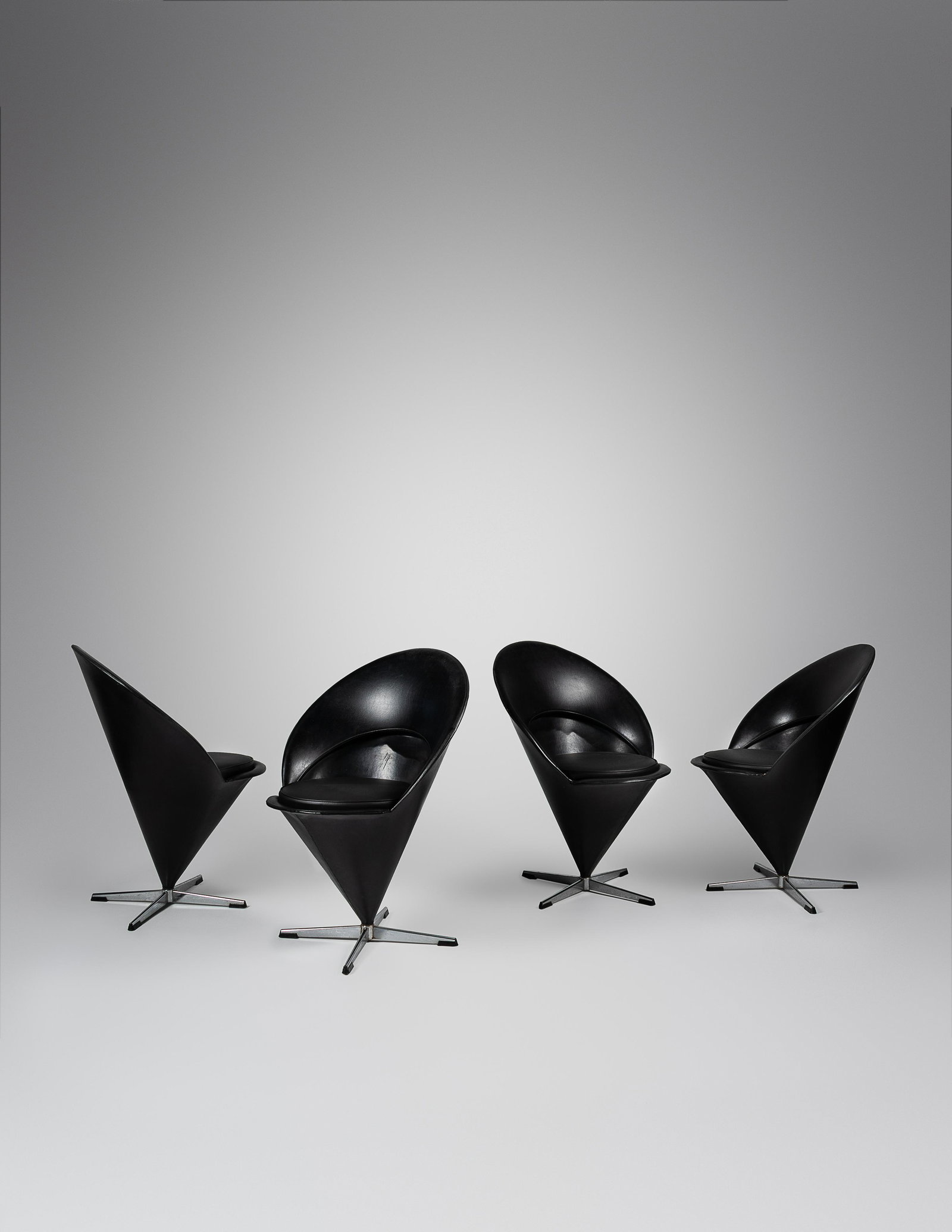 Verner Panton (Danish, 1926-1998) Set of Four Cone: Verner Panton (Danish, 1926-1998) Set of Four Cone Chairs, Frem Rojle, Denmark aluminum, vinyl, leather, plastic manufacturer's paper labels to underside of each seat cushion 22 1/2 x 24 1/4 x 32 inch