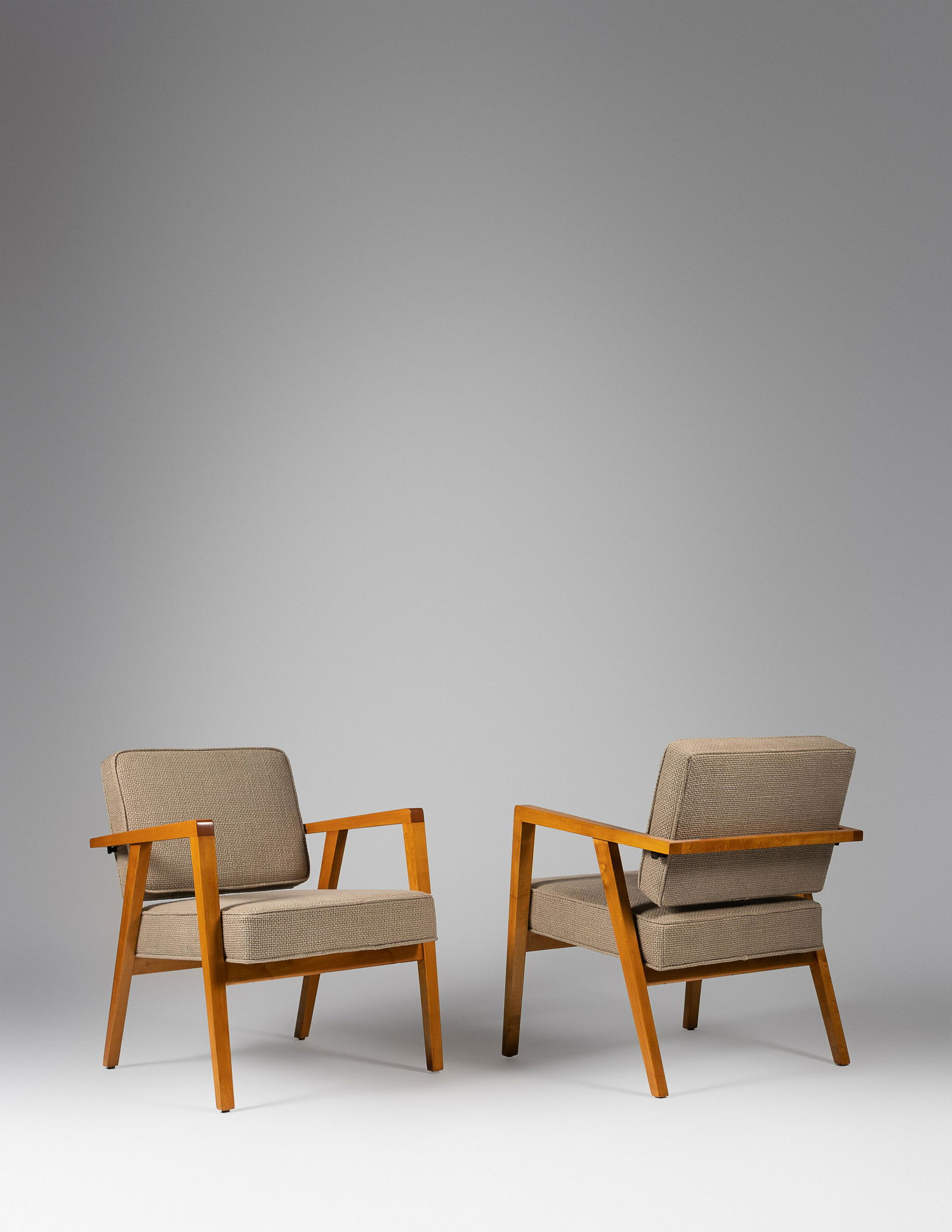 Franco Albini (Italian, 1905-1977) Pair of Lounge: Franco Albini (Italian, 1905-1977) Pair of Lounge Chairs, Knoll, USA maple, upholstery manufacturer's paper label to underside 31 x 24 3/4 x 28 inches. For condition inquiries please contact Nathan Br