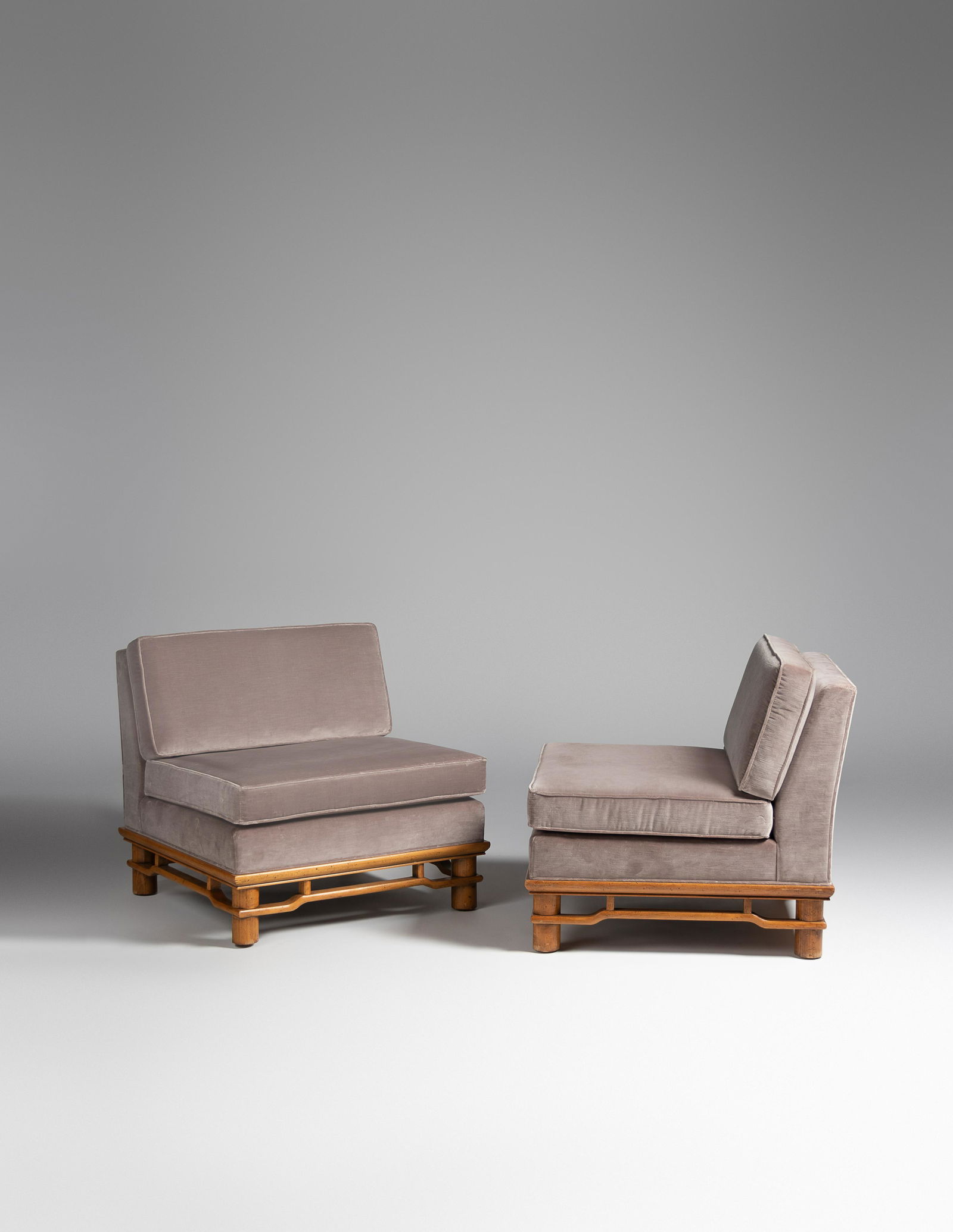 Michael Taylor Pair of Lounge Chairs, Baker Furniture,: Michael Taylor Pair of Lounge Chairs, Baker Furniture, USA upholstery, pecan wood manufacturer's label to underside of seat cushion 31 x 31 x 33 inches. For condition inquiries please contact Nathan B