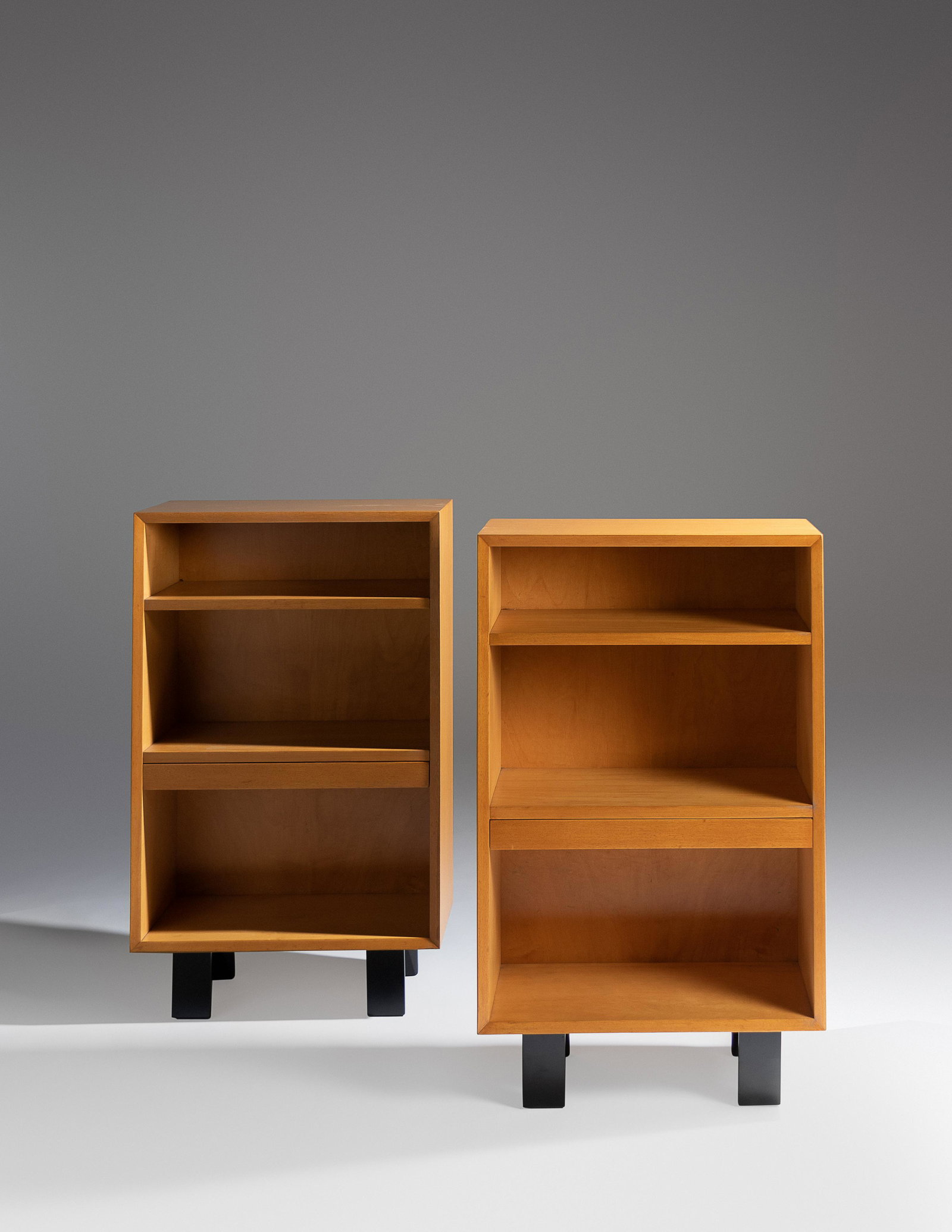George Nelson (American, 1908-1986) Pair of: George Nelson (American, 1908-1986) Pair of Bookshelves, Herman Miller, USA maple, ebonized maple 39 3/4 x 24 x 12 inches. For condition inquiries please contact Nathan Brady at nathanbrady@hindmanauc