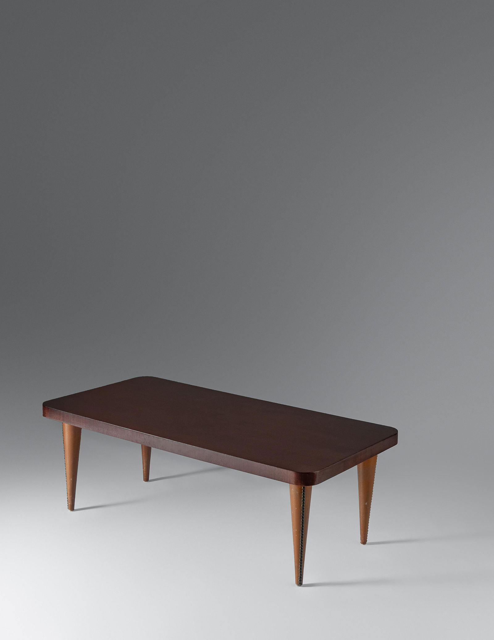 Gilbert Rohde (American, 1894-1944) Coffee Table,: Gilbert Rohde (American, 1894-1944) Coffee Table, Herman Miller, USA paldao veneer, acacia burl, vinyl, brass 16 x 44 x 22 1/2 inches. For condition inquiries please contact Nathan Brady at nathanbrad