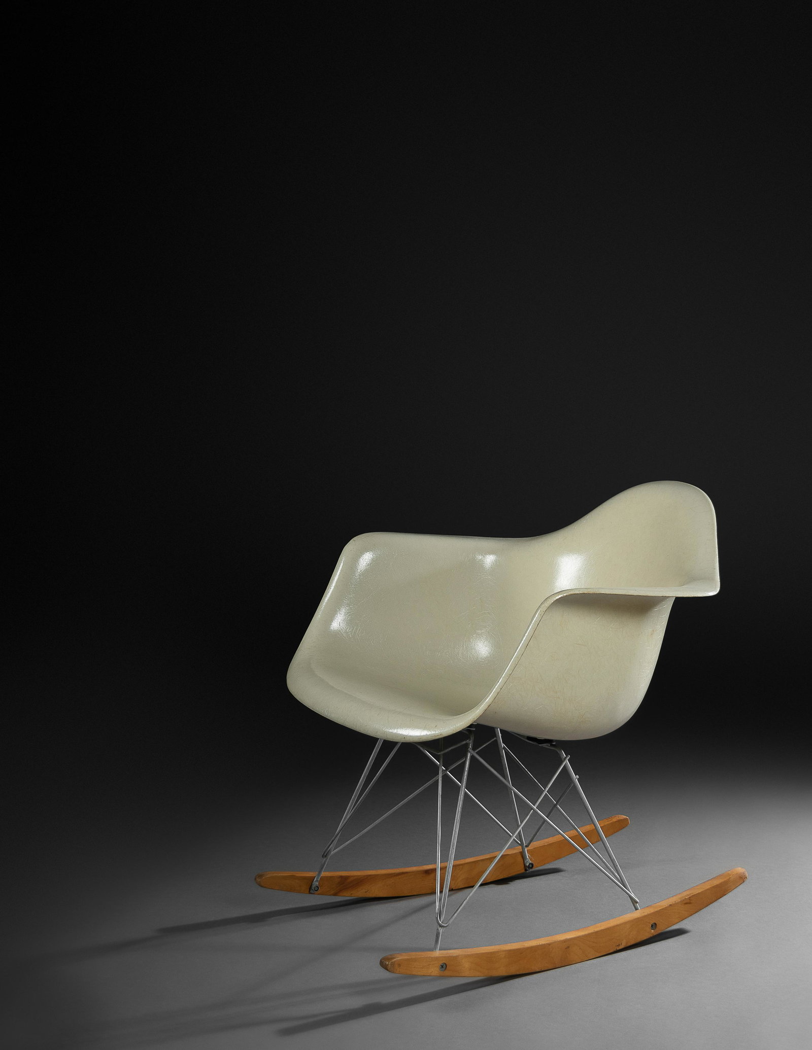 Charles and Ray Eames (American, 1907-1978 | American,: Charles and Ray Eames (American, 1907-1978 | American, 1912-1988) RAR Rocking Chair, Herman Miller, USA fiberglass, enameled steel, maple 26 1/2 x 24 1/2 x 27 inches. overall stable condition. crack t