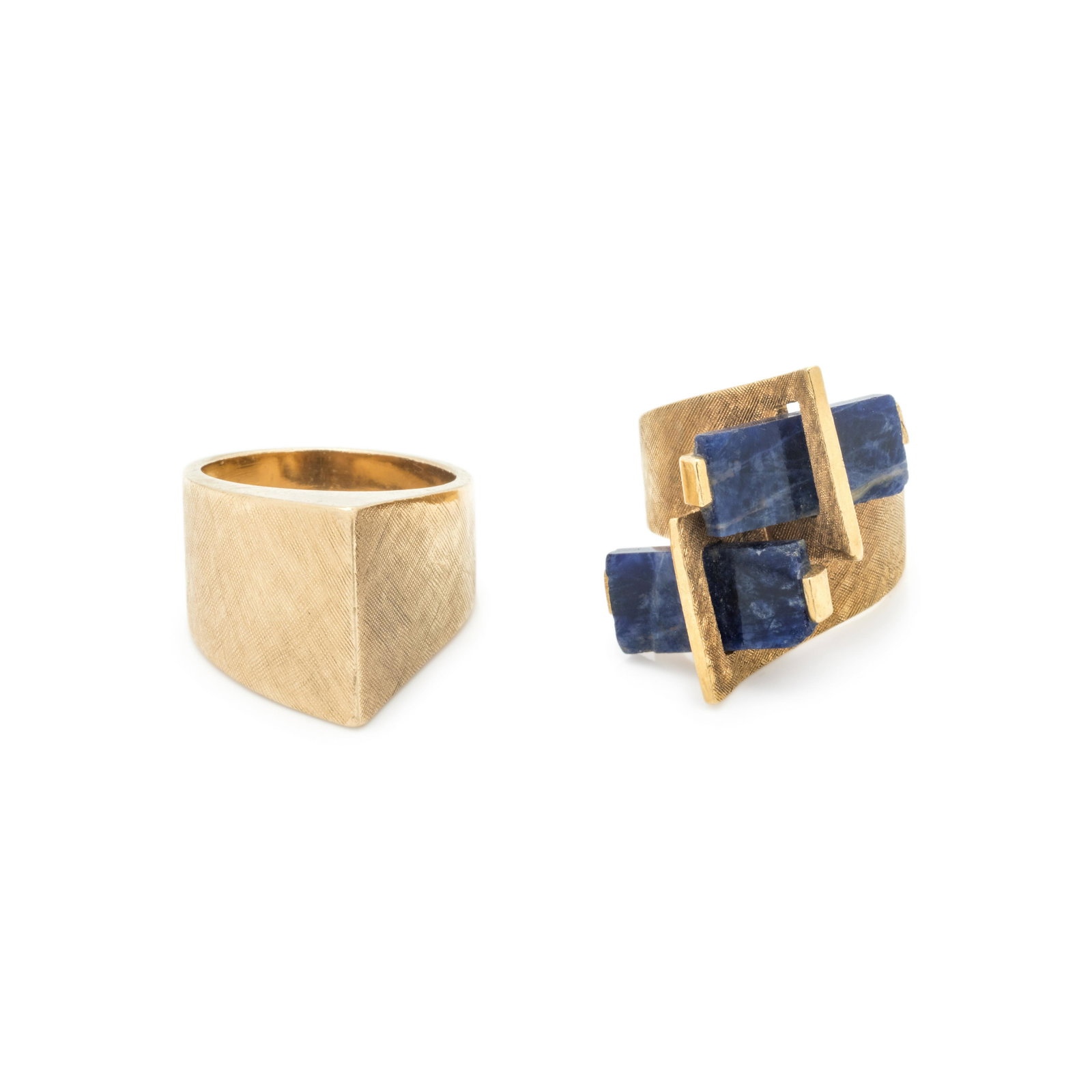 COLLECTION OF YELLOW GOLD RINGS: COLLECTION OF YELLOW GOLD RINGS Consisting of an 18 karat Florentine finish ring containing two rectangular sodalite plaques, together with a 14 karat sculptural ring with Florentine finish. Stamp: IT