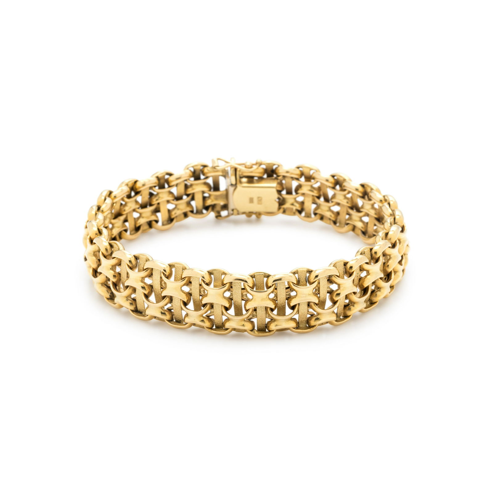 YELLOW GOLD BRACELET: YELLOW GOLD BRACELET Consisting of a fancy link chain with high polish and textured links measuring approximately 14.00 mm wide. Stamp: Luxe G 18Kt ITALY. 16.80 dwt.